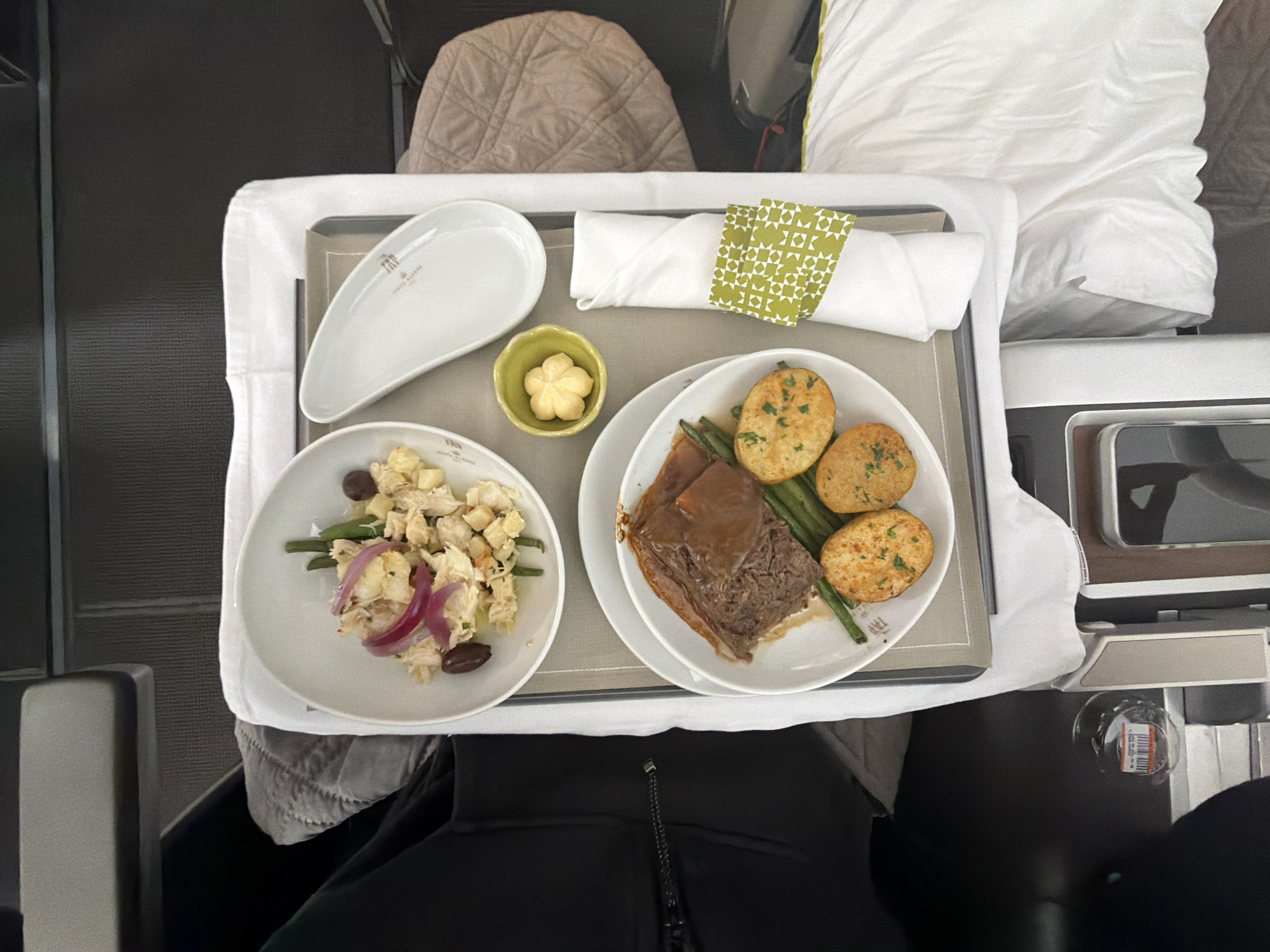 Passengers document in-flight meal service, snacks during Mississauga flight