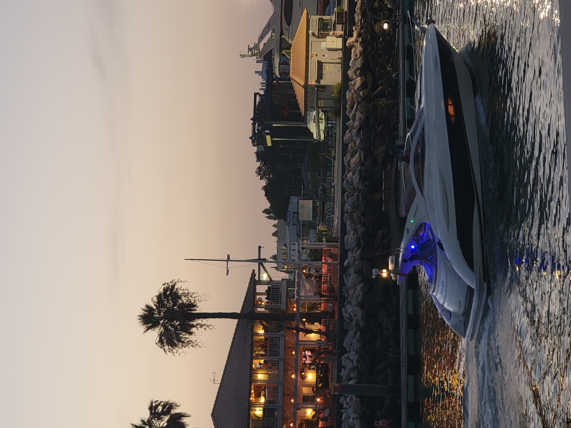 Quarteira marina at dusk: yachts, hotels, and waterfront scenes