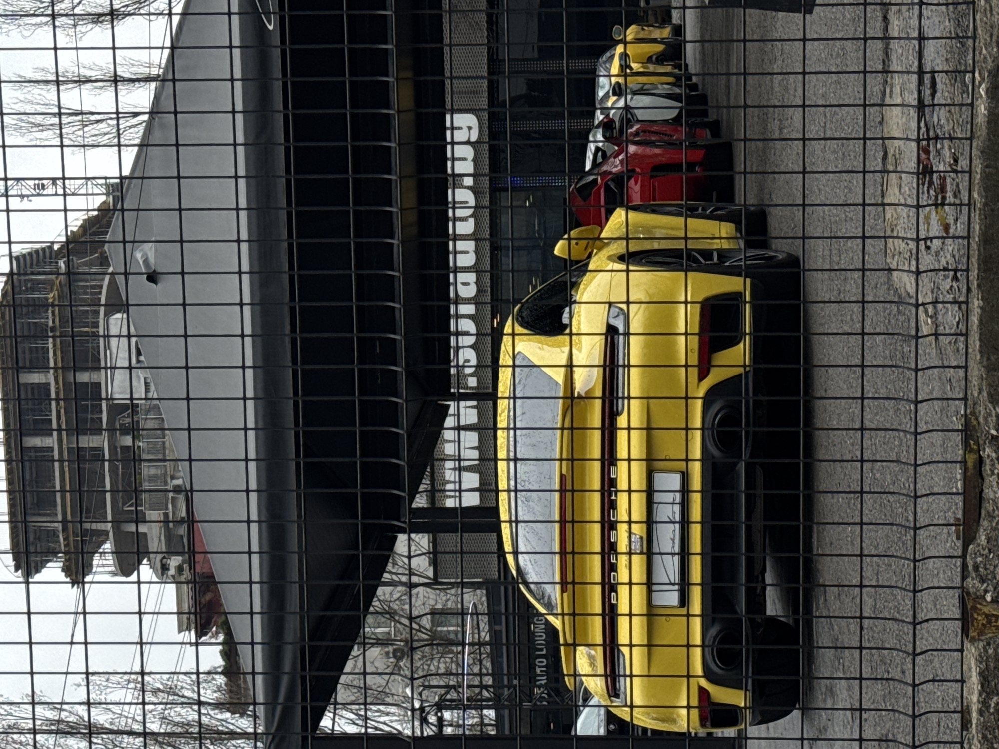 Yellow Porsche spotted parked behind fence in Sofia