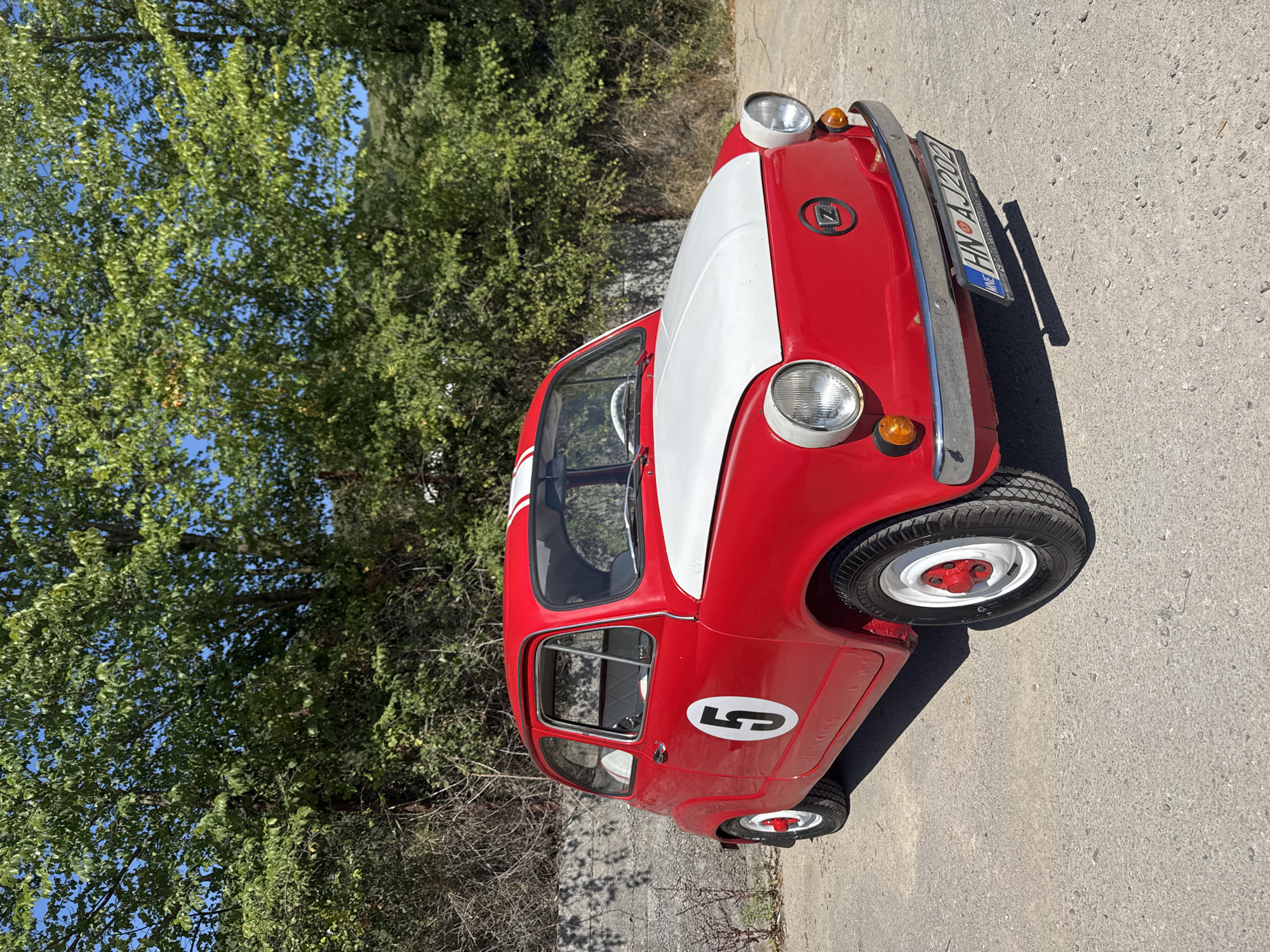 Racing-liveried vintage Fiat 600 parked in Montenegro