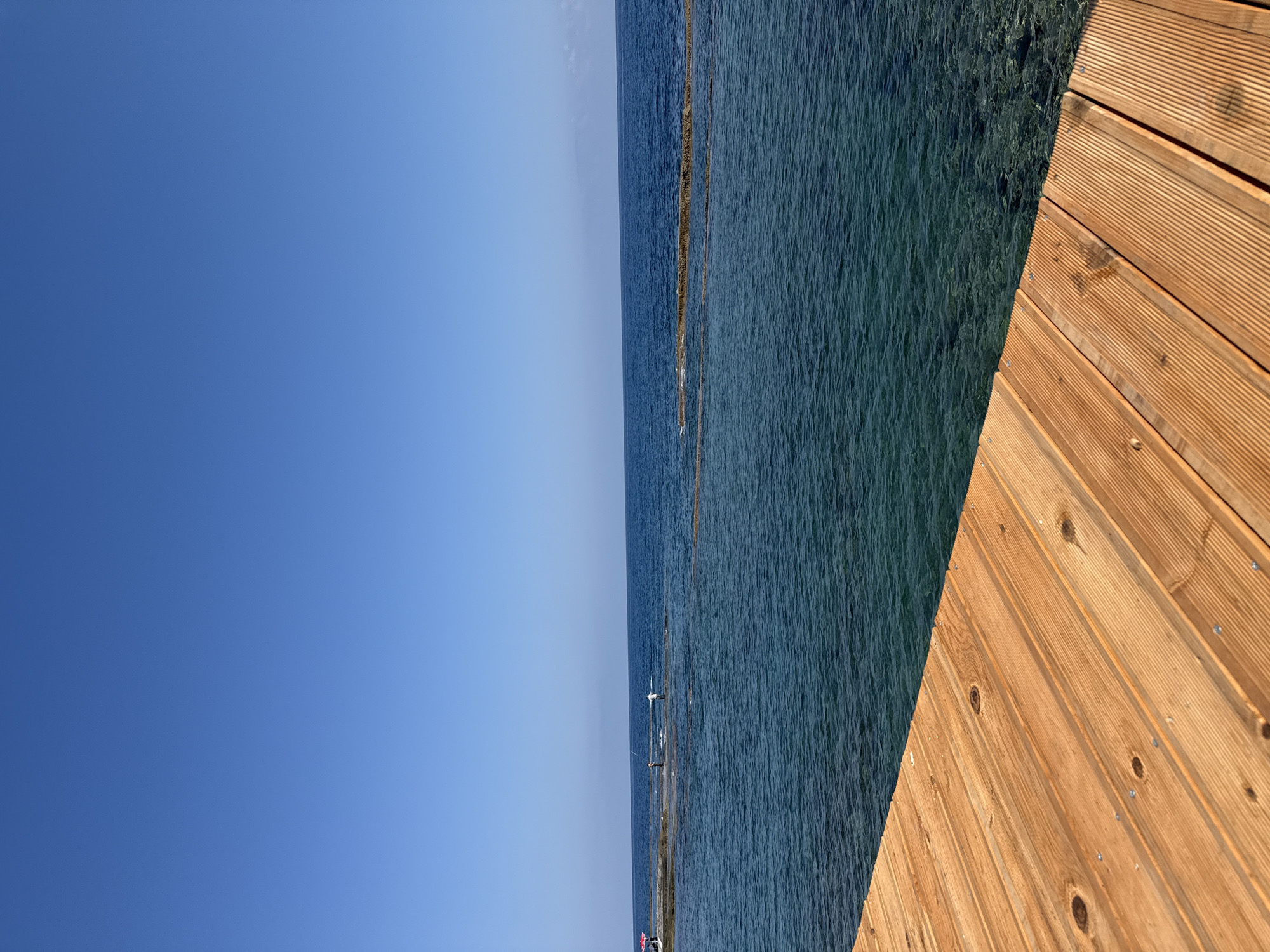 Wooden pier meets clear blue sea off Northern Cyprus coast