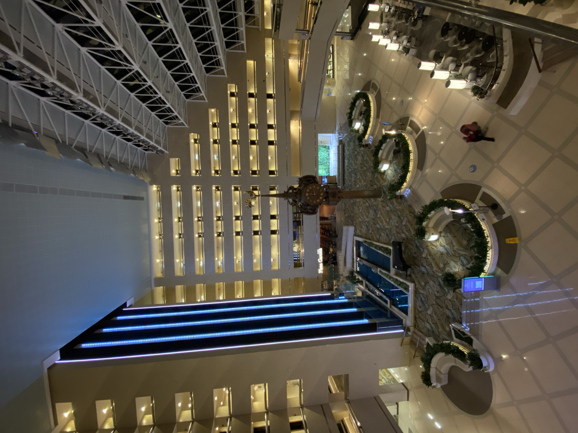 Ornate clock observed in Moscow atrium interior