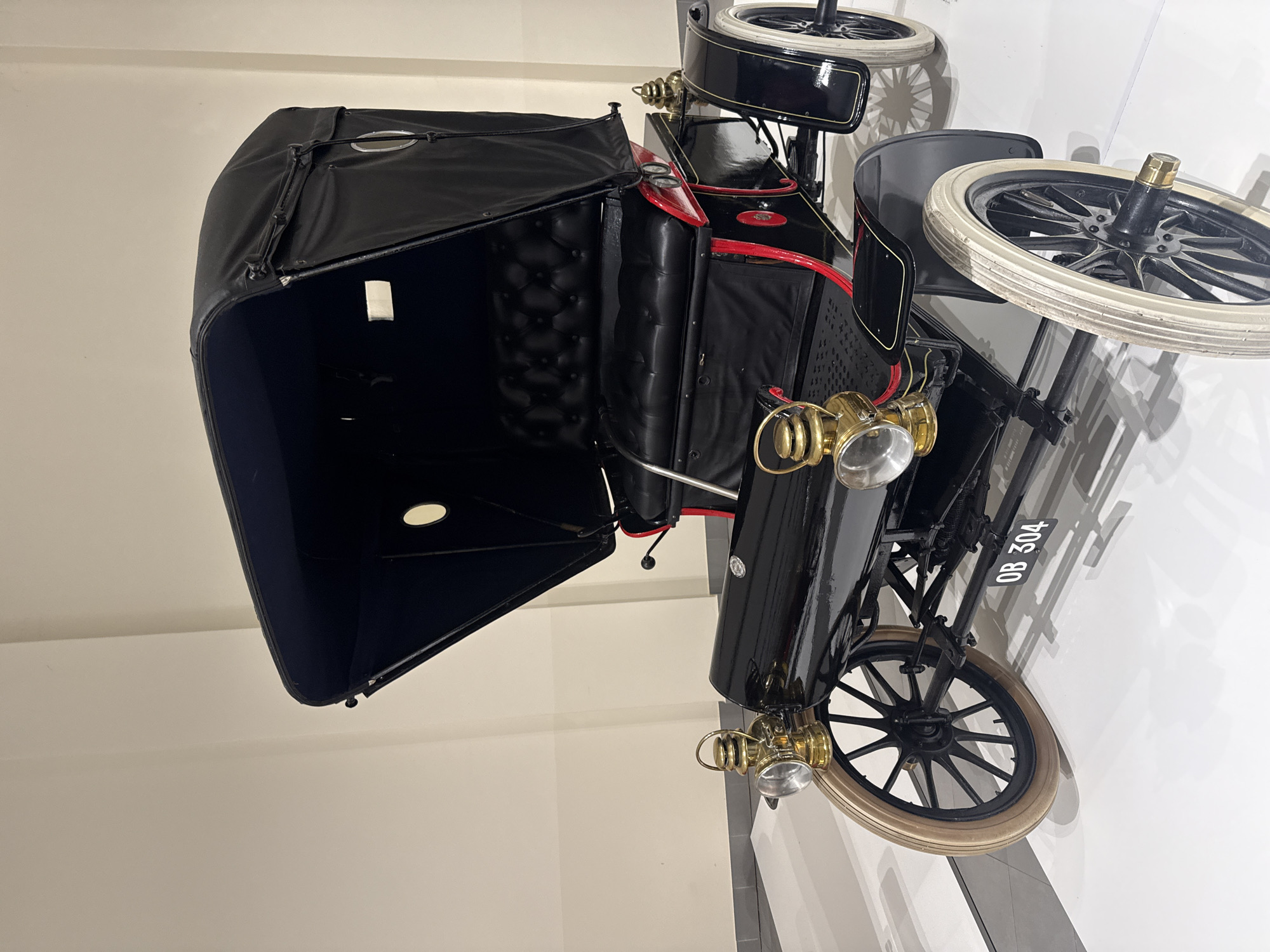 Visitors document vintage car museum exhibits in Stellenbosch