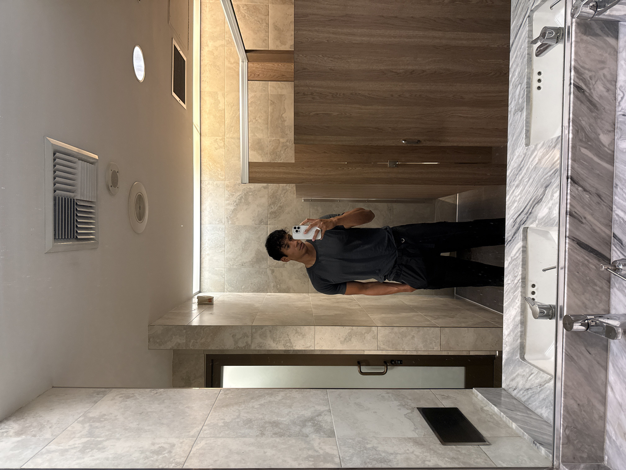Man takes bathroom mirror selfie in Los Angeles
