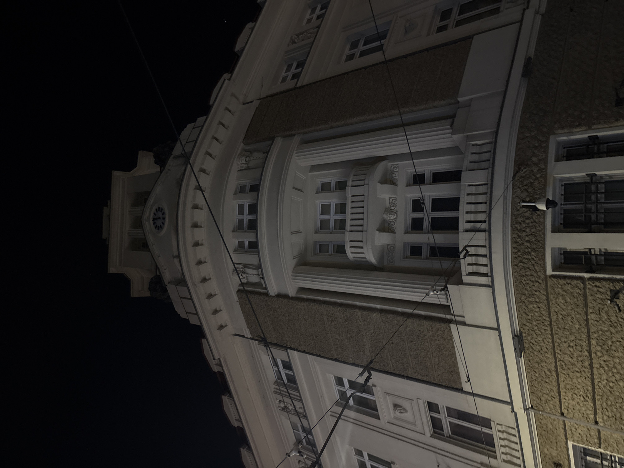 Night walk through wet Sofia streets captures urban scenes