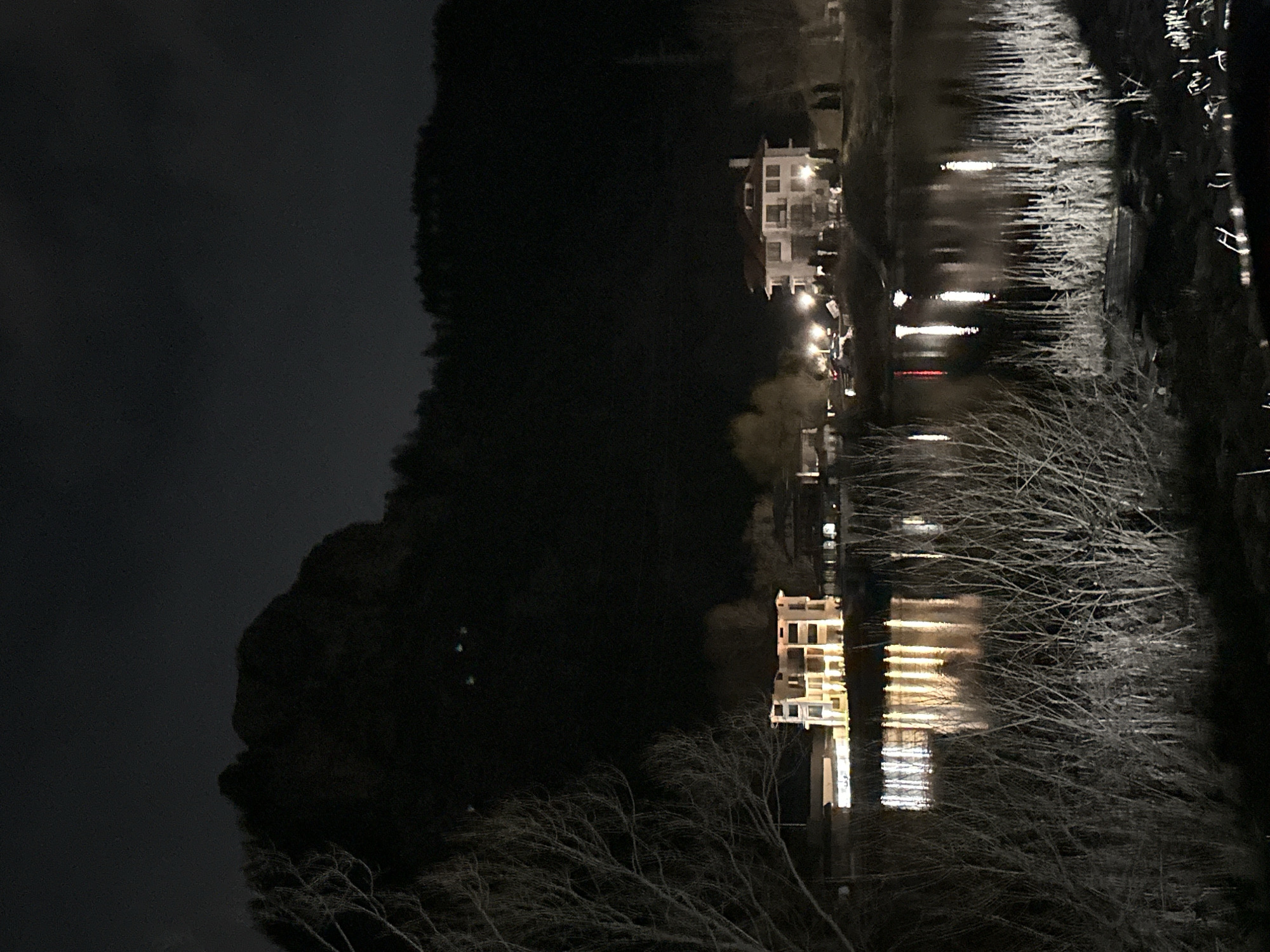 Evening lights reflect on water in Smolyan, Bulgaria
