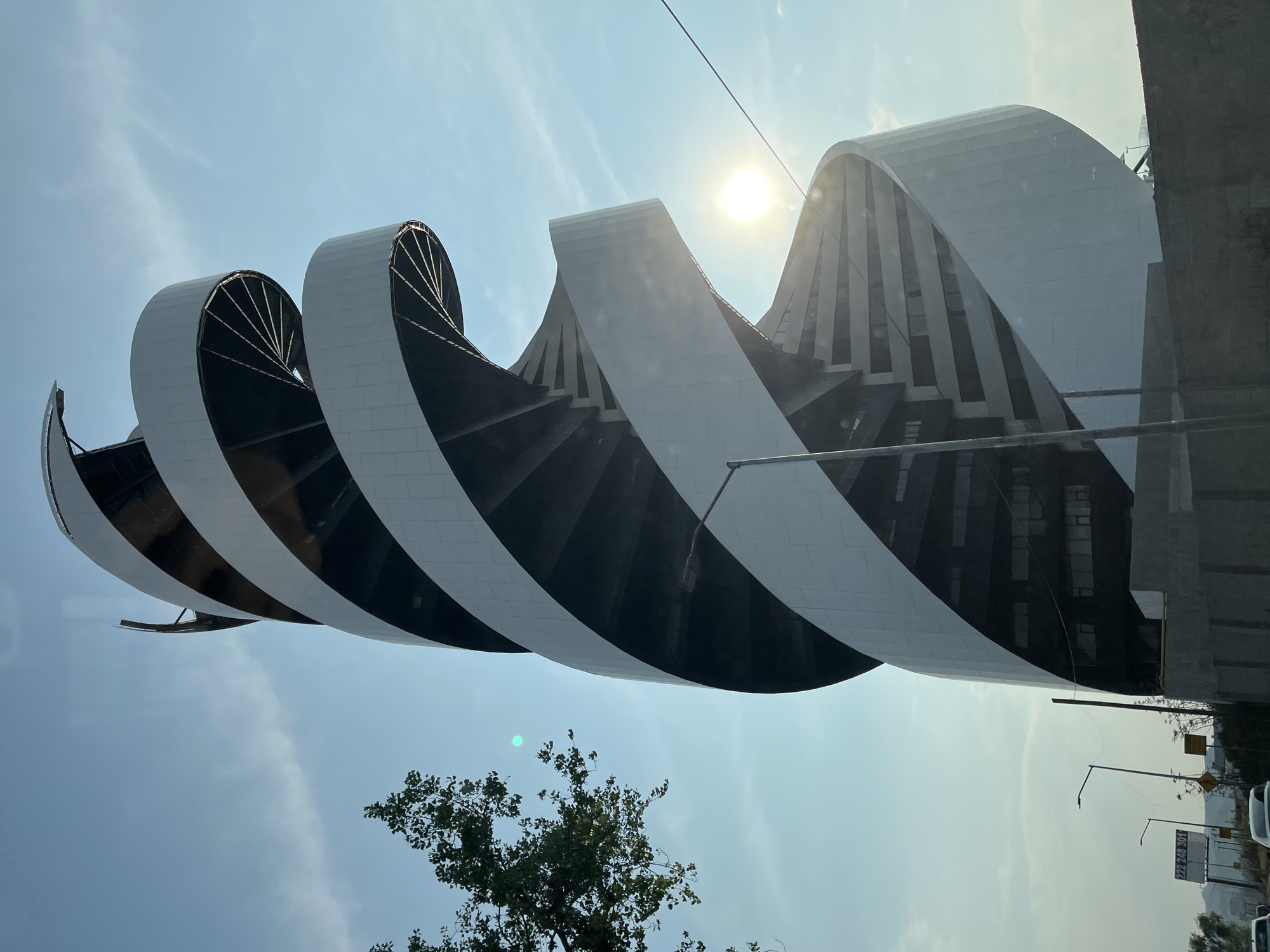 Modern undulating building observed in San Bernardino Tlaxcalancingo, Mexico