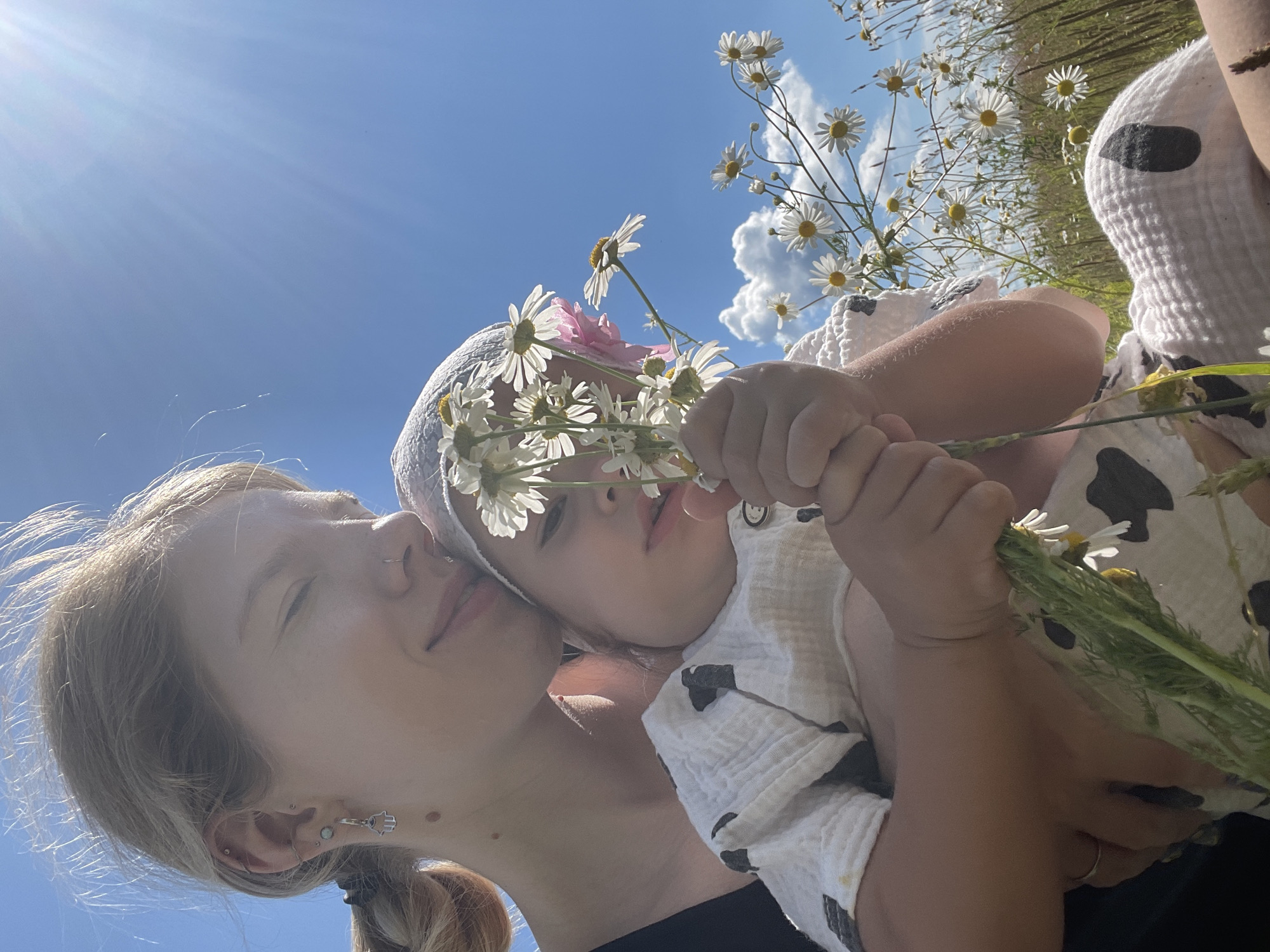 Summer afternoon in a Russian daisy field with a child and wildflowers