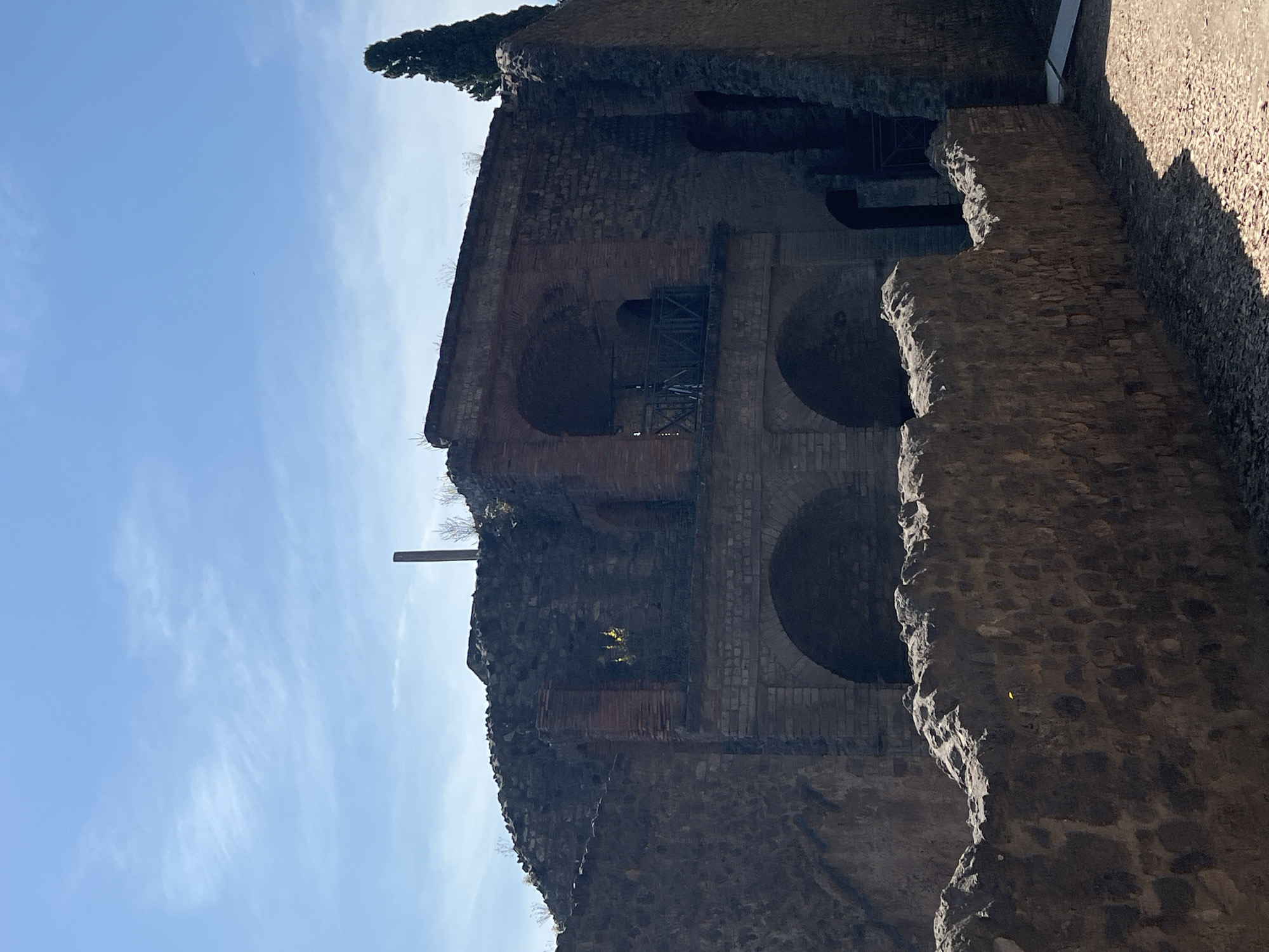 Tourist documents Pompeii ruins during morning visit in Italy