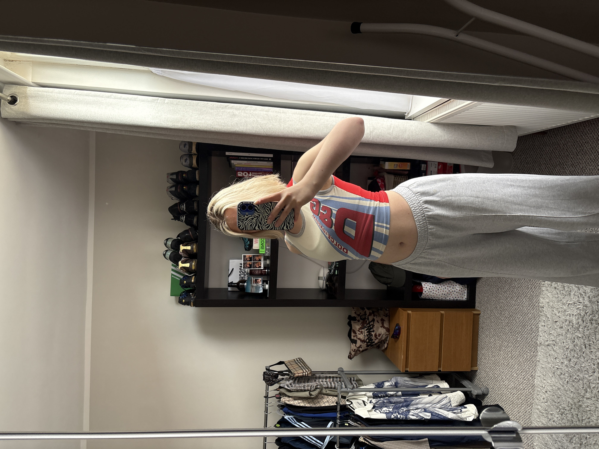 Mirror selfie taken with zebra-print phone case in Manchester