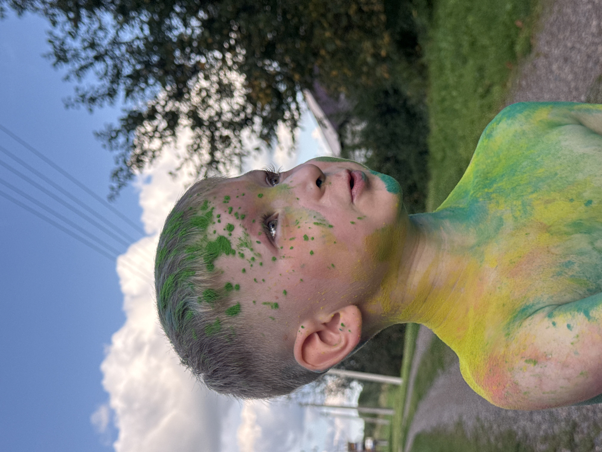 Covered in powder paint on a gravel road in rural Russia