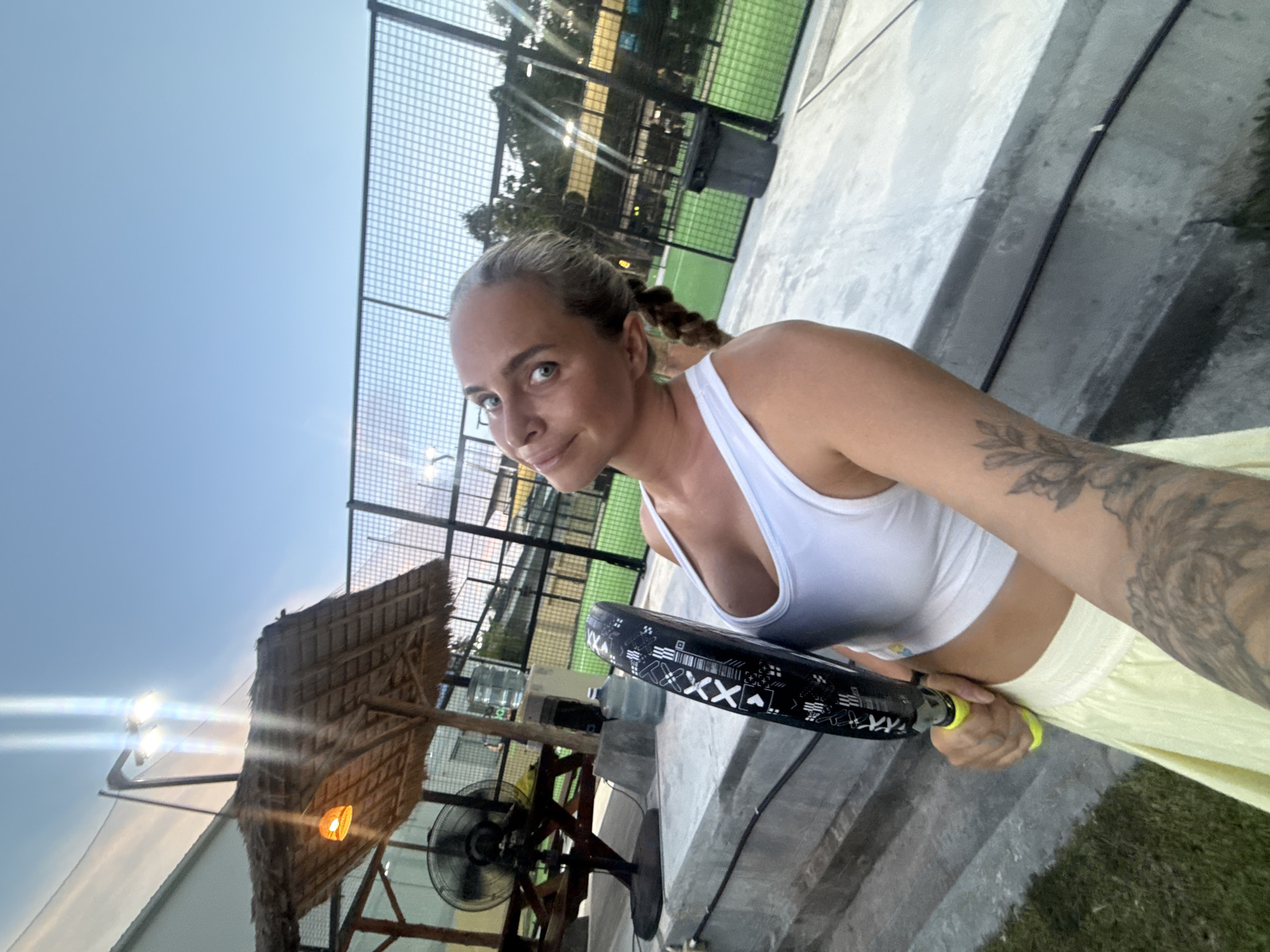 Padel session at an outdoor Ko Samui court, day into evening