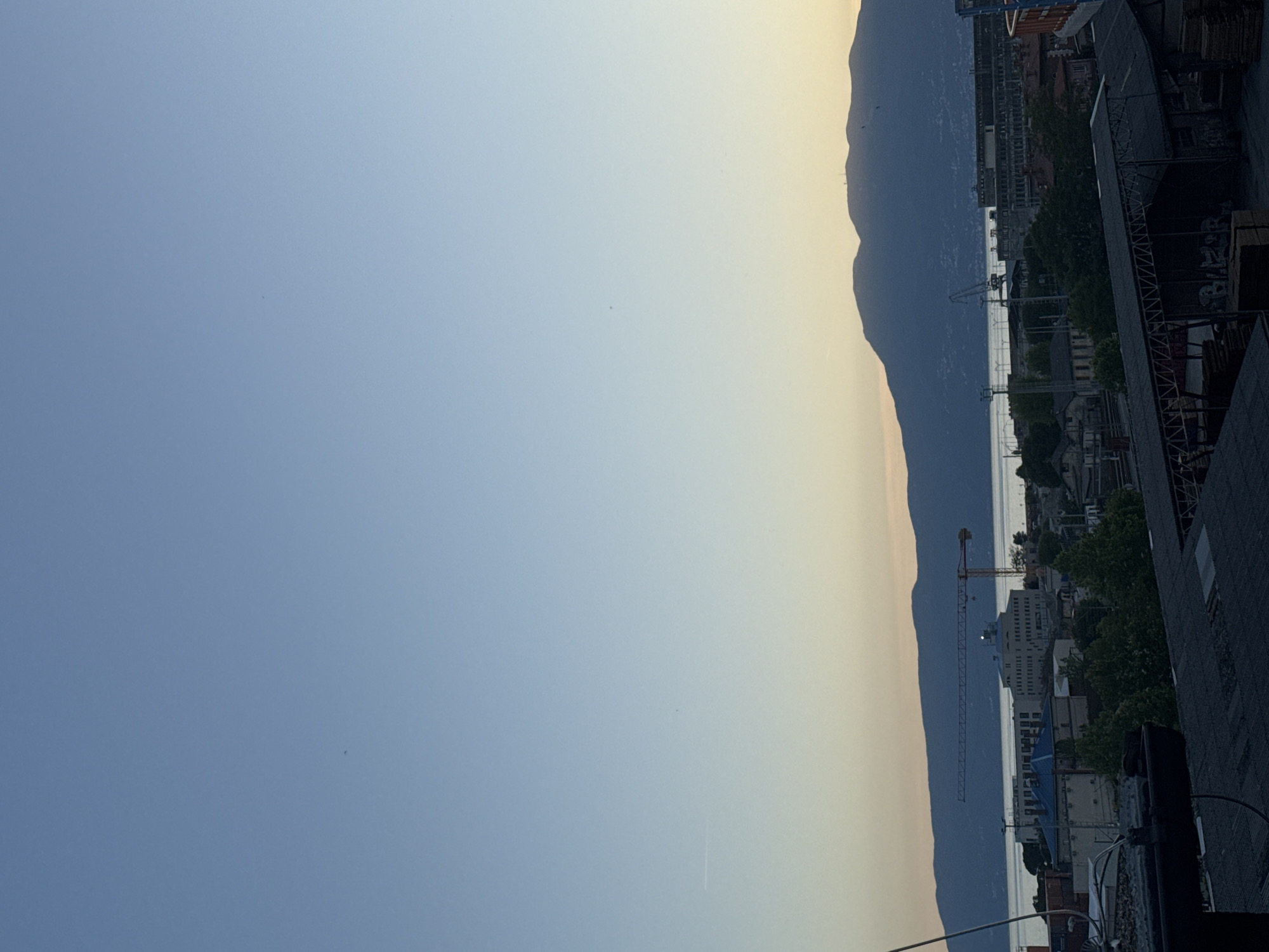 Elevated view of Rijeka cityscape captured under blue skies