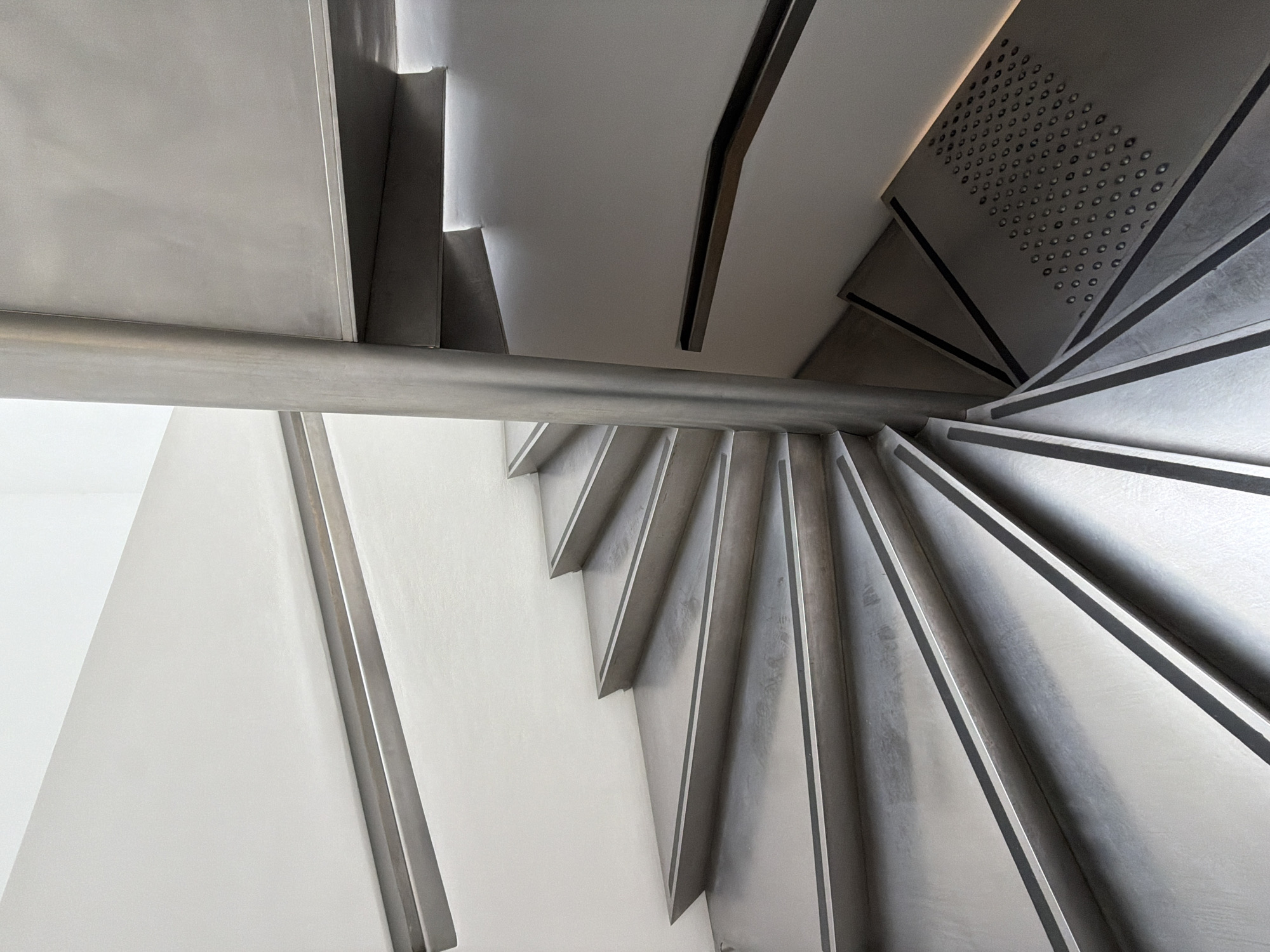 Modern spiral staircase photographed from above in Paris