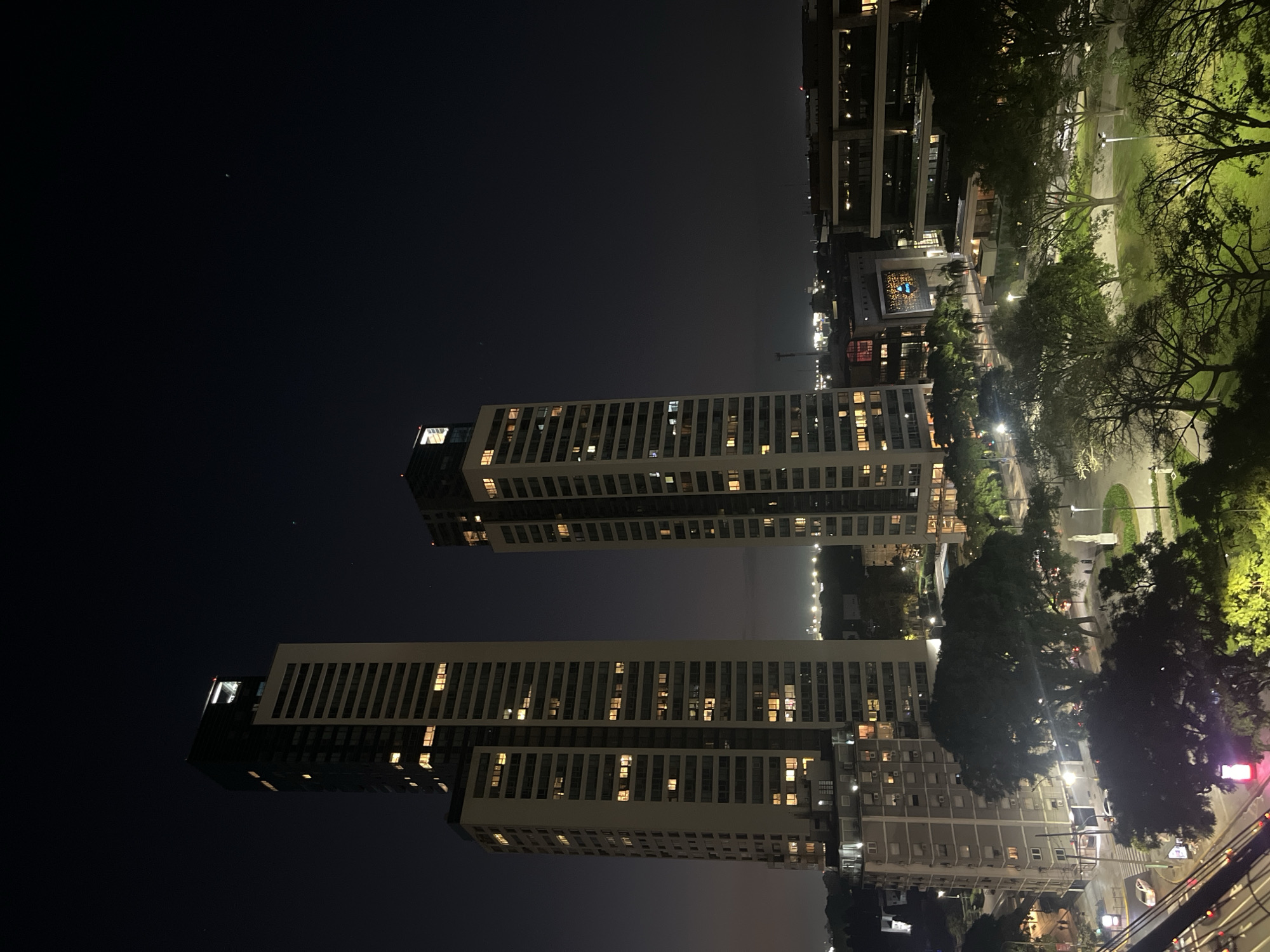 Nighttime view of lit apartment buildings captured in Buenos Aires