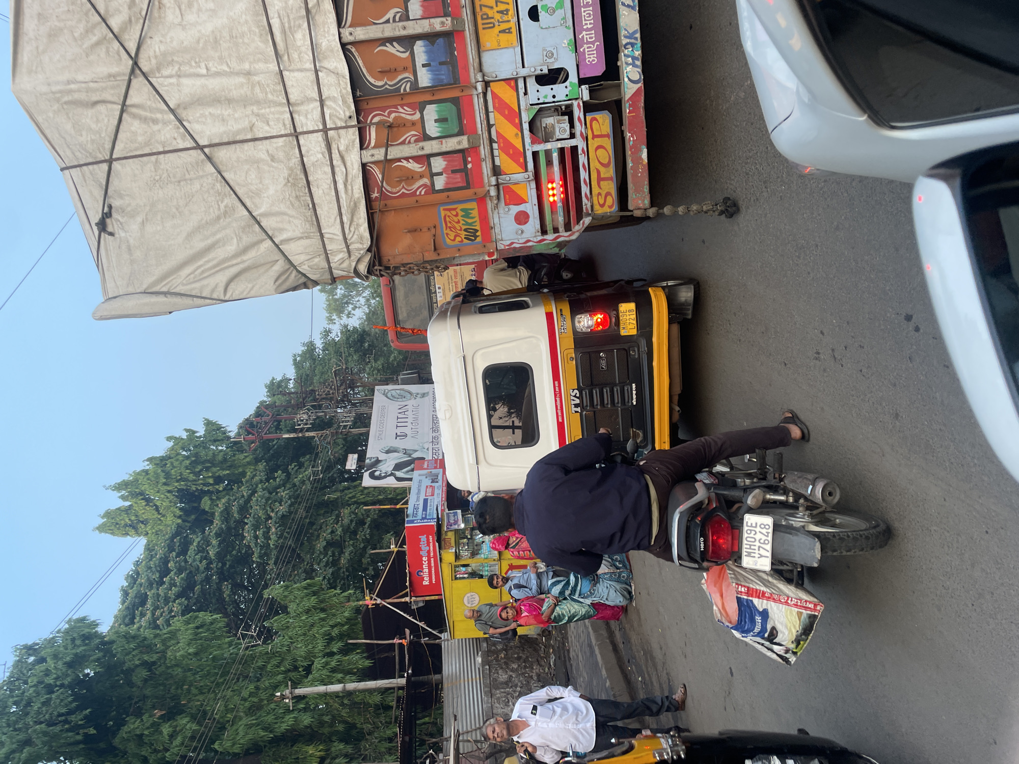 Cargo truck observed on busy Kolhapur street near commercial area