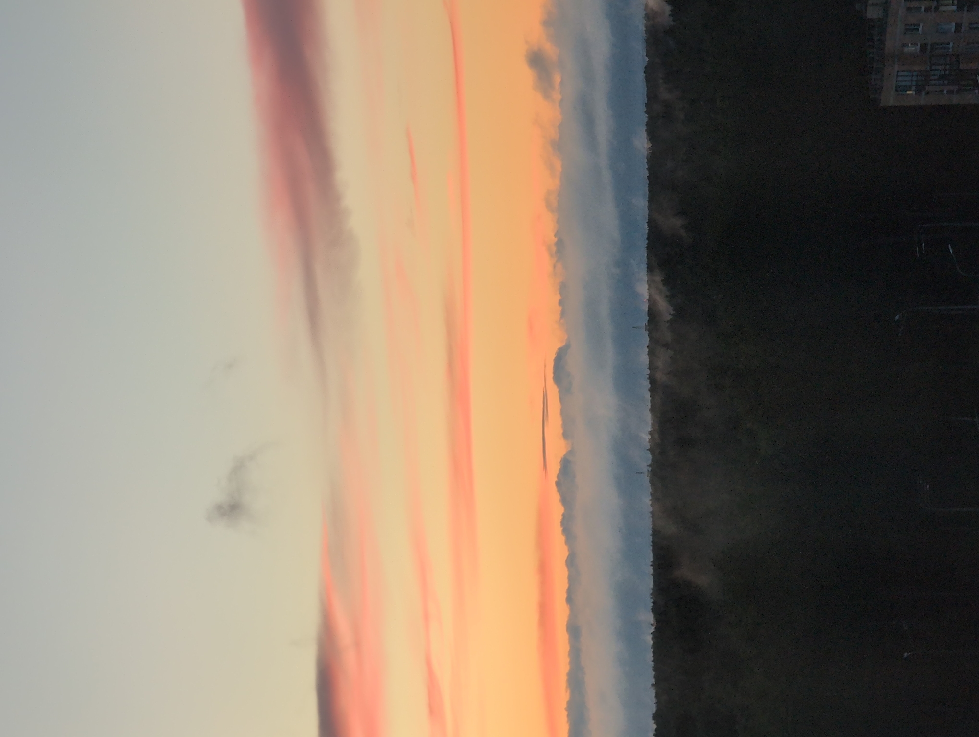 Saint Petersburg sunset paints the sky above residential blocks
