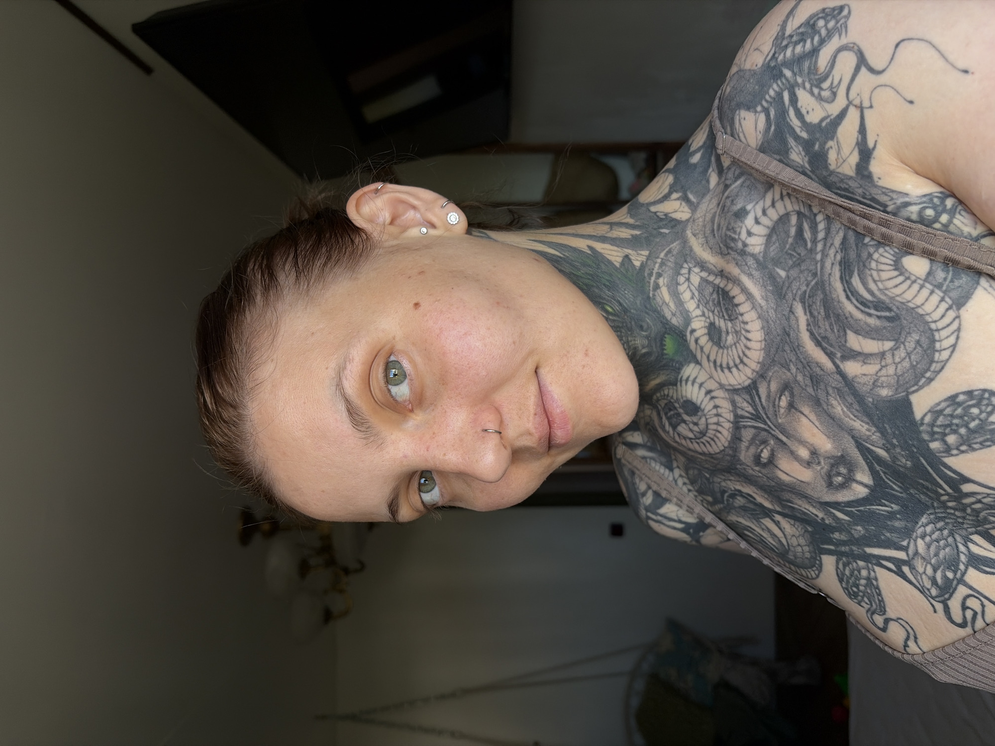 Woman documents morning routine, tattoos, water collection in Chaikovsky