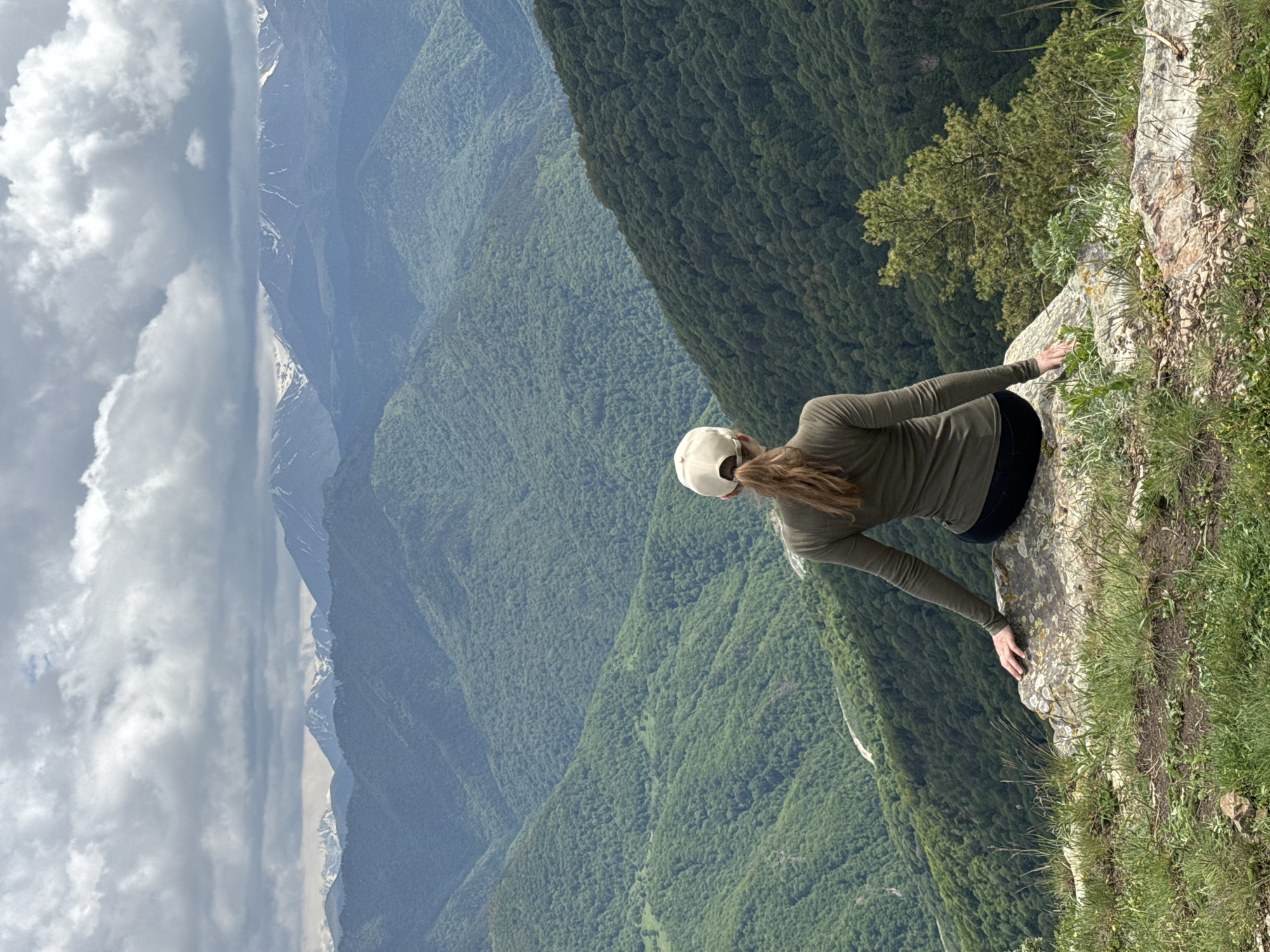 Tourists photograph mountain scenery at Russian Caucasus overlooks