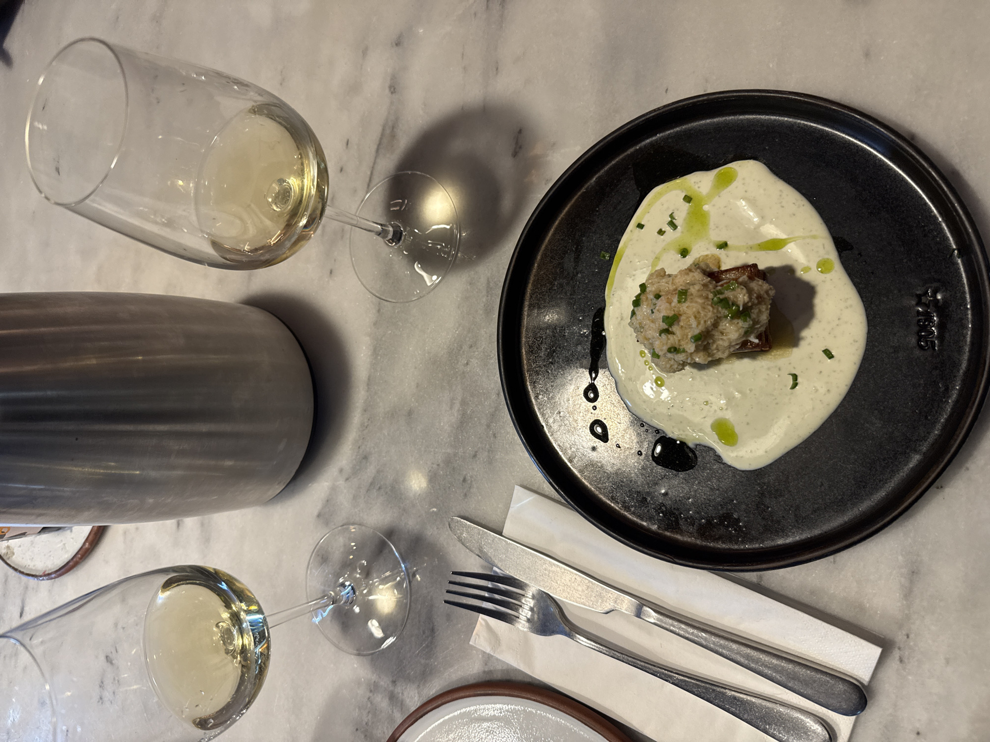 Wine glasses observed on marble table in London restaurant
