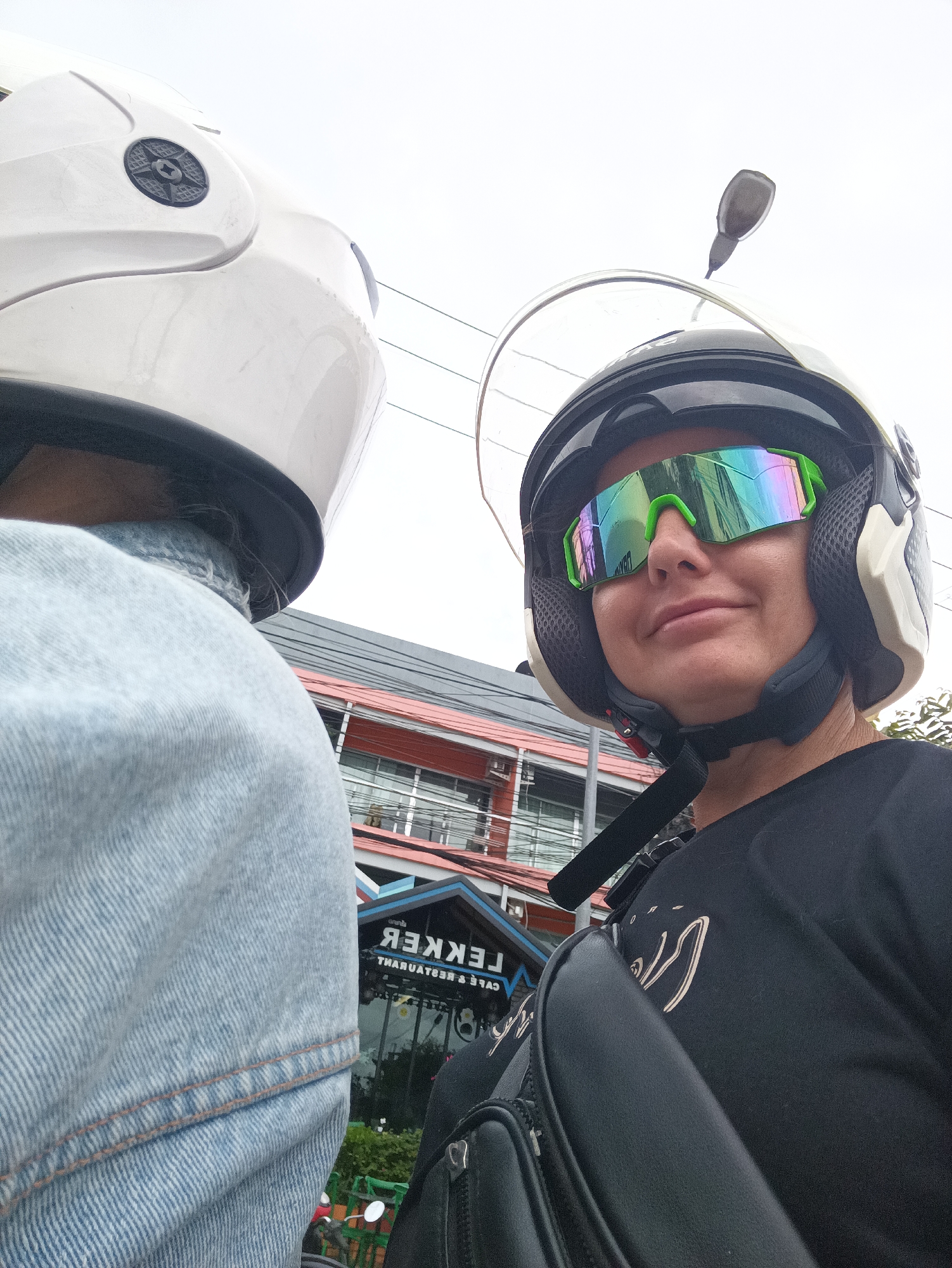 Two people ride scooter in Ban Ao Nang