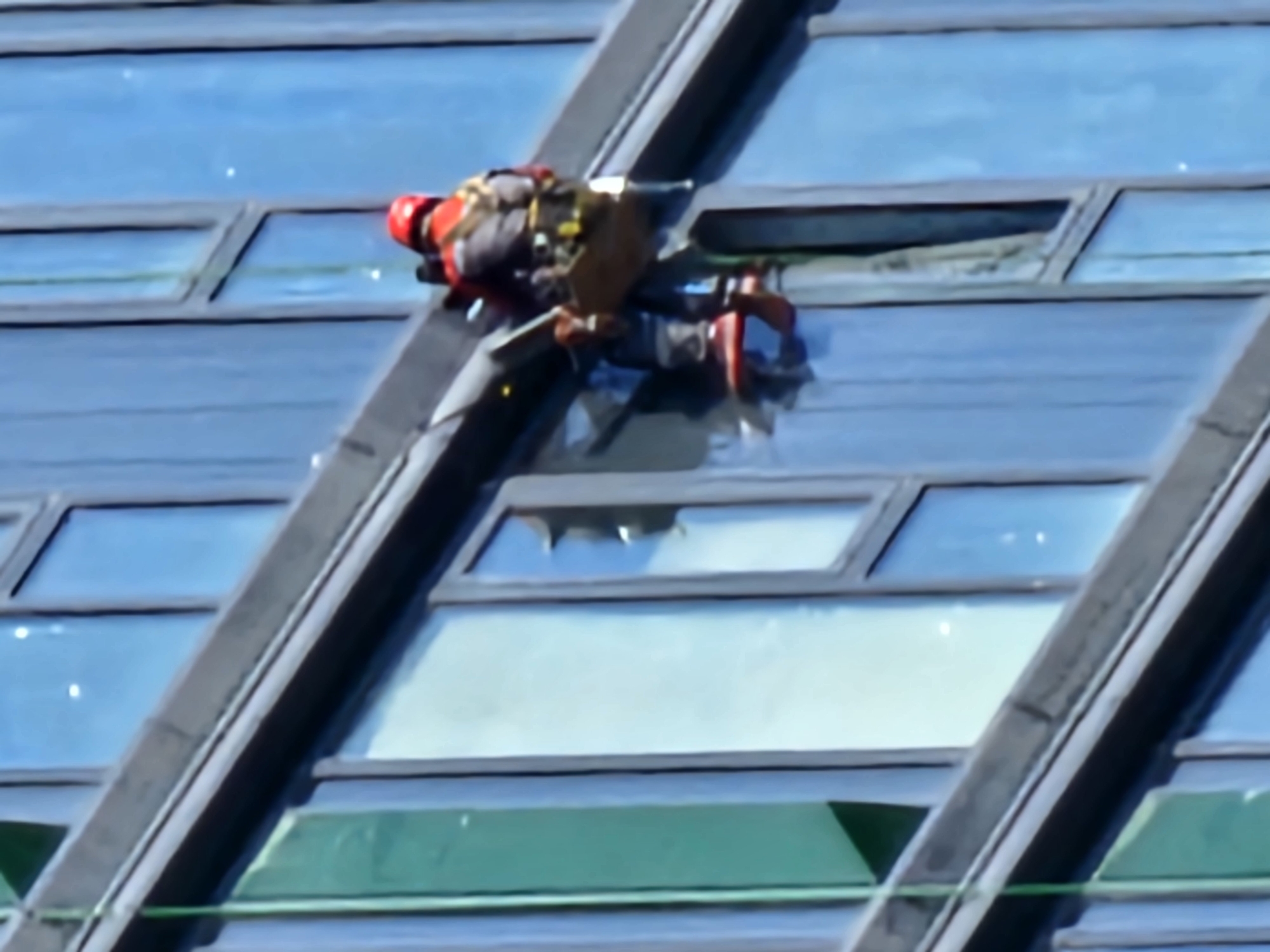 High-rise construction and window work underway on Moscow glass building