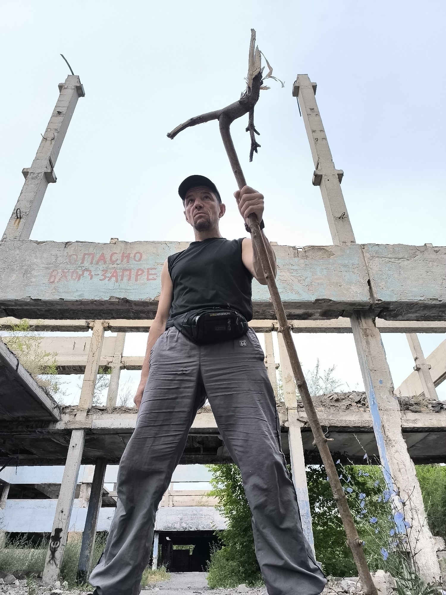 Ruins, a red sports car, and foliage in Qarağandı