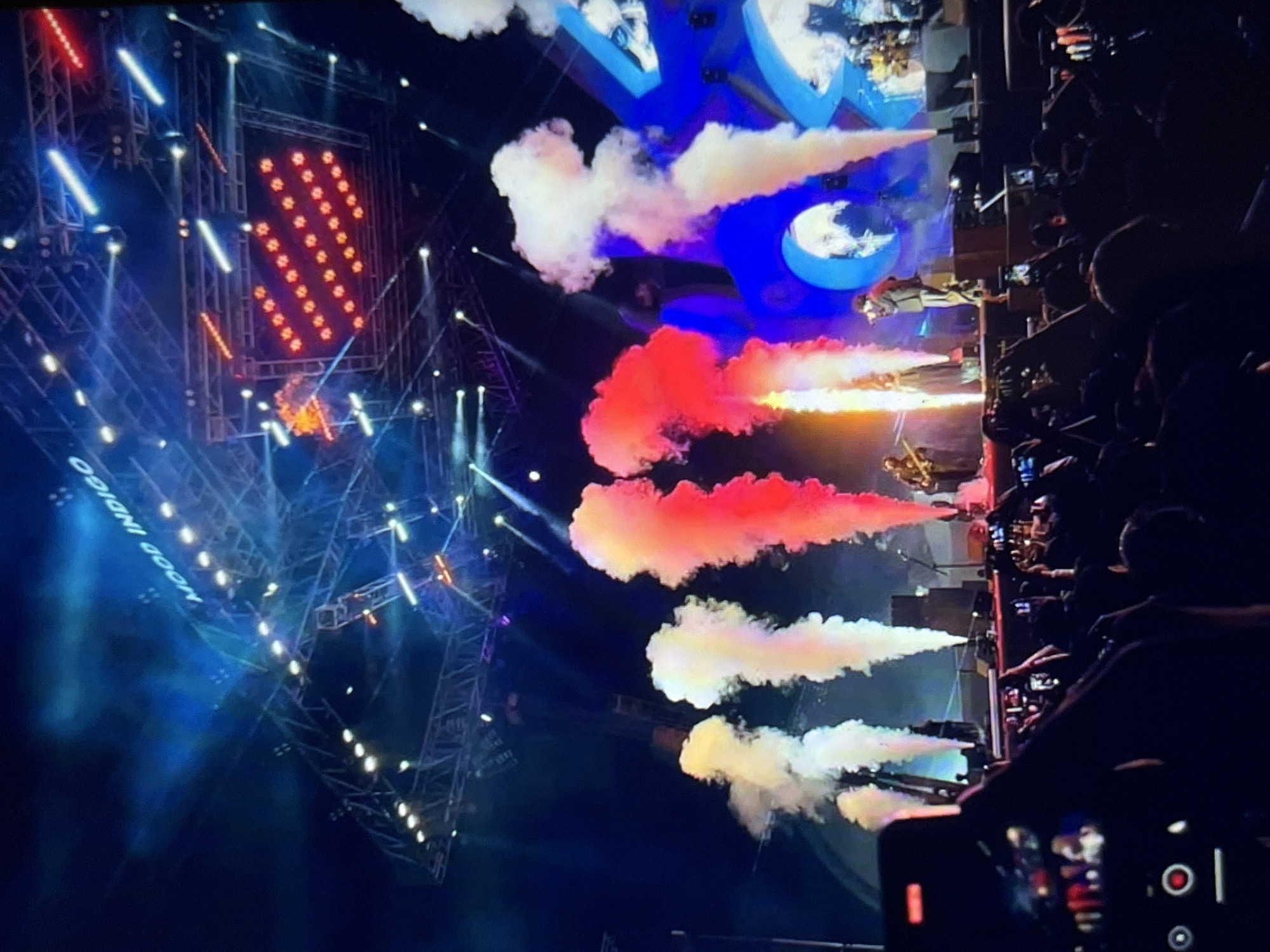 Live concert with pyrotechnics, crowds, and a Venezuela reference