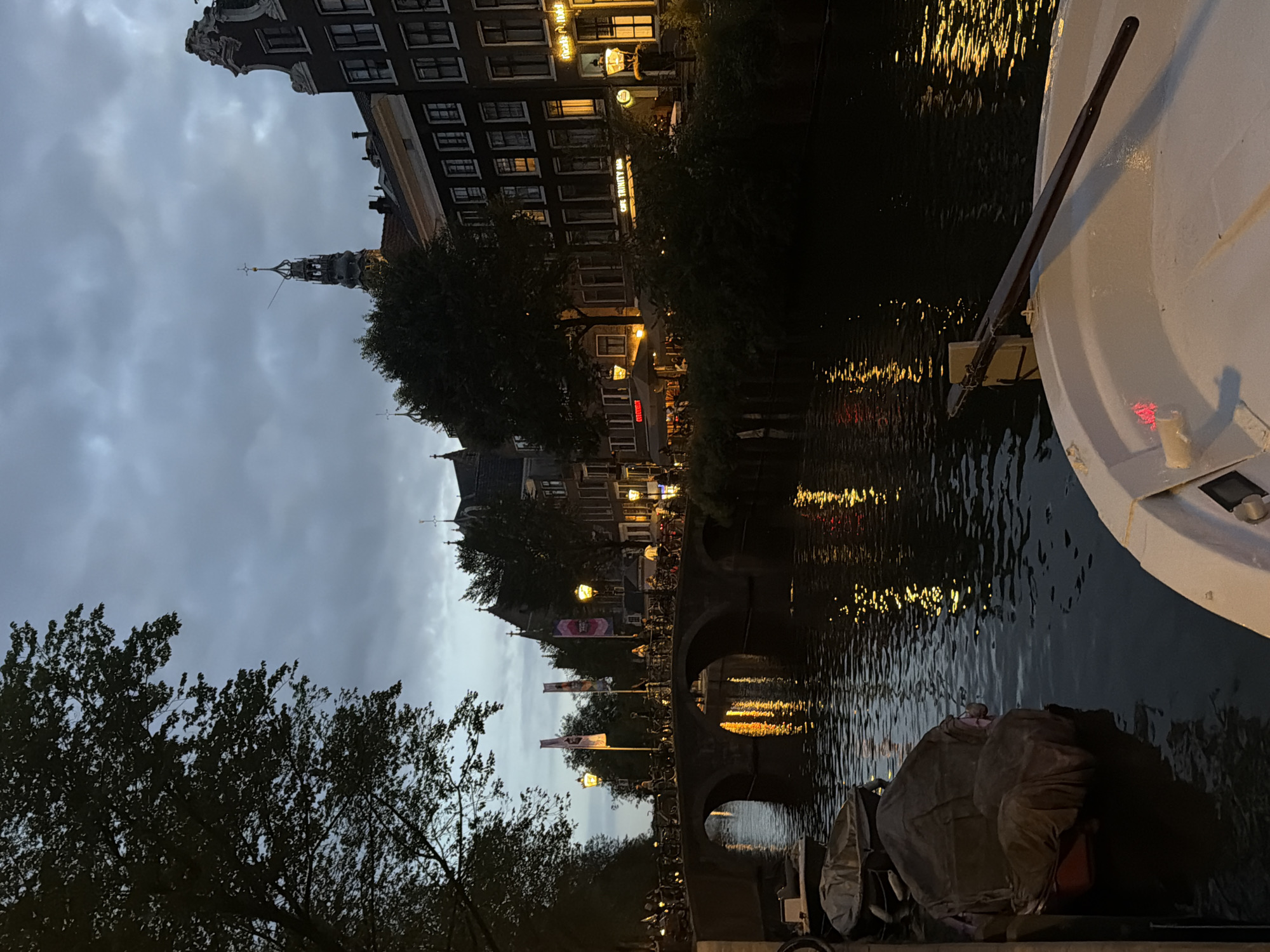 Amsterdam at dusk: canals and church spires in twilight blue