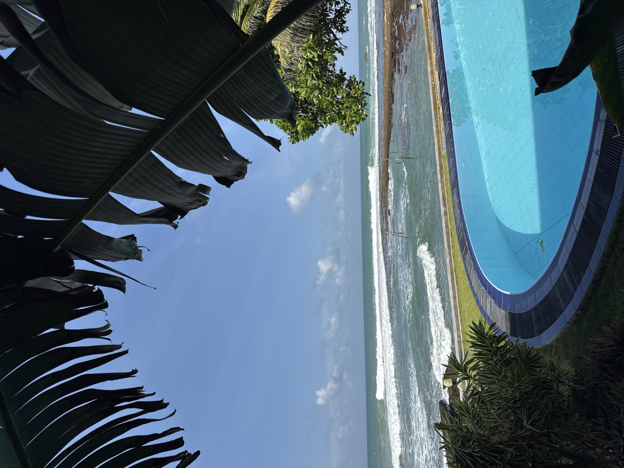 Poolside ocean view at a Sri Lankan coastal resort