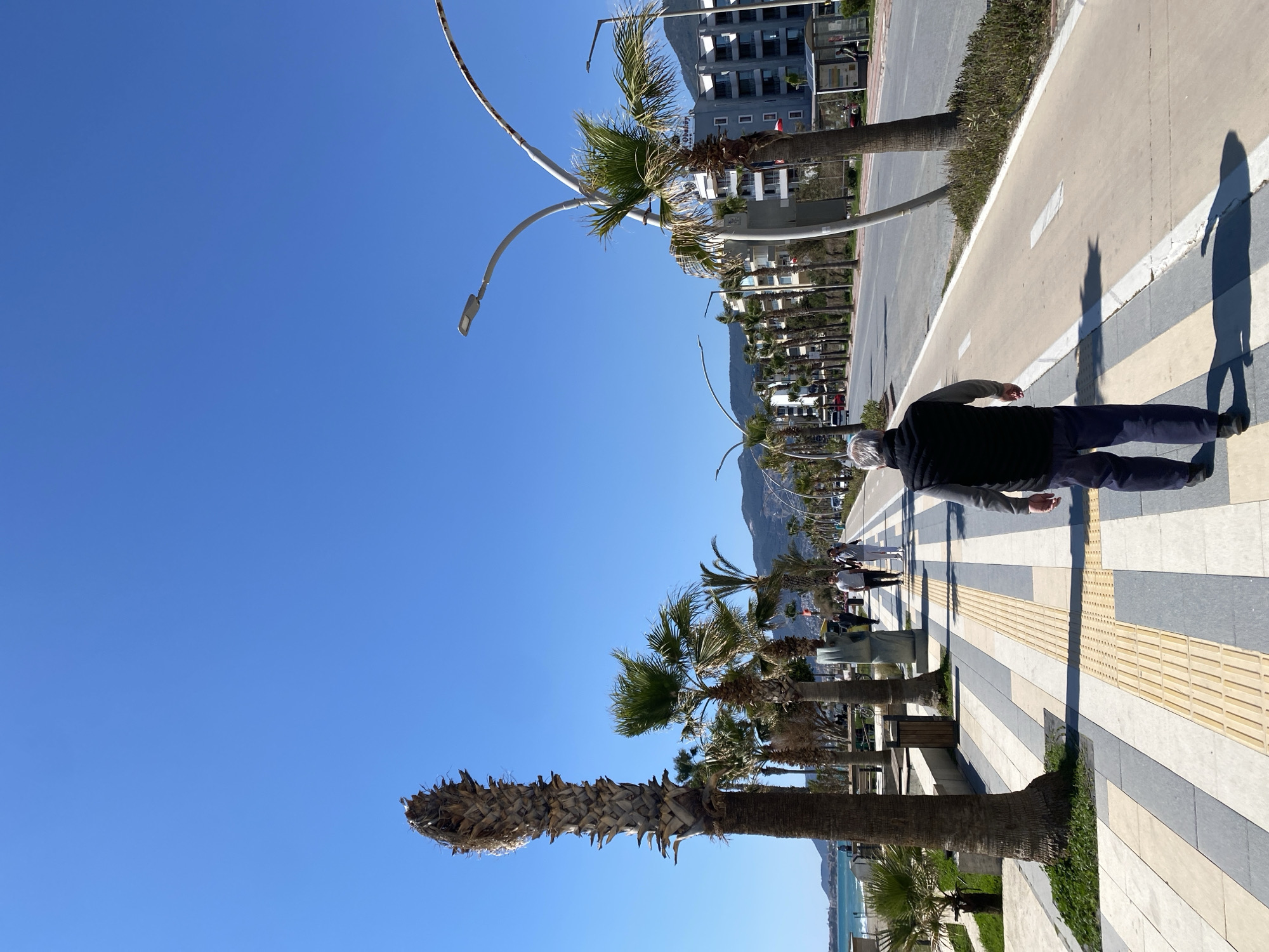 Tourist captures casual street scenes during morning walk in Alanya