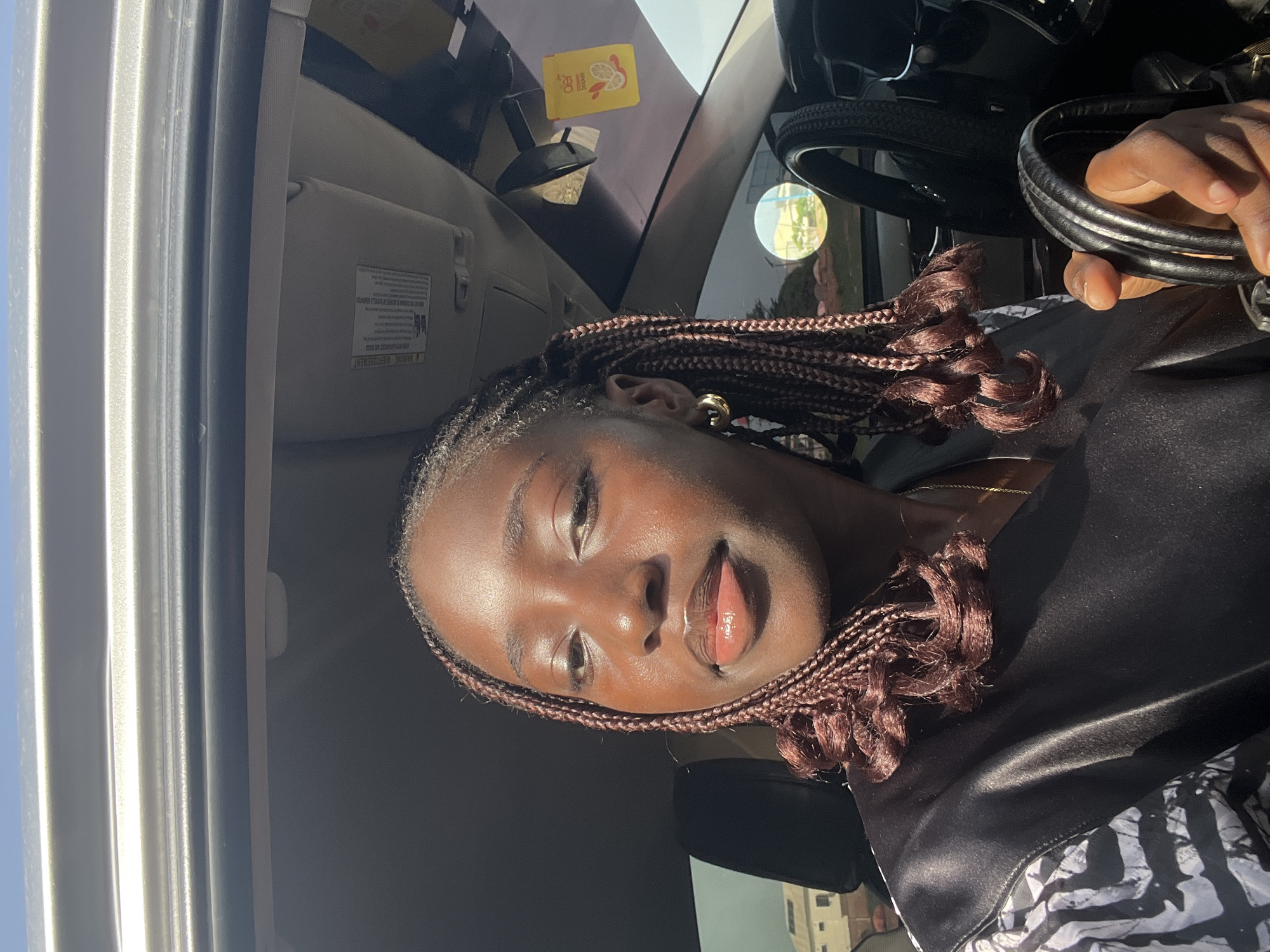 Traffic personnel manage vehicle movement in Nigerian village parking area