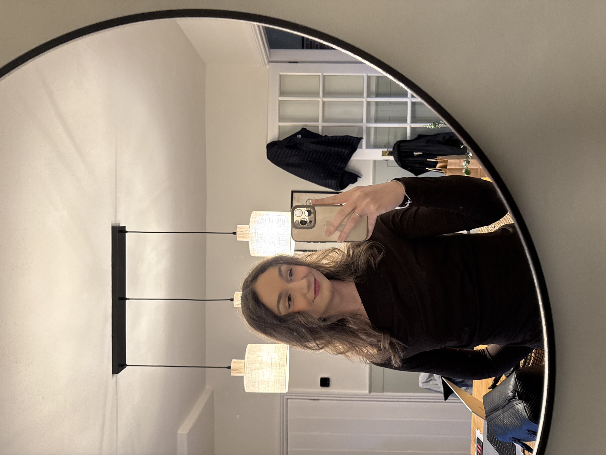 Person takes mirror selfie in Windermere interior room