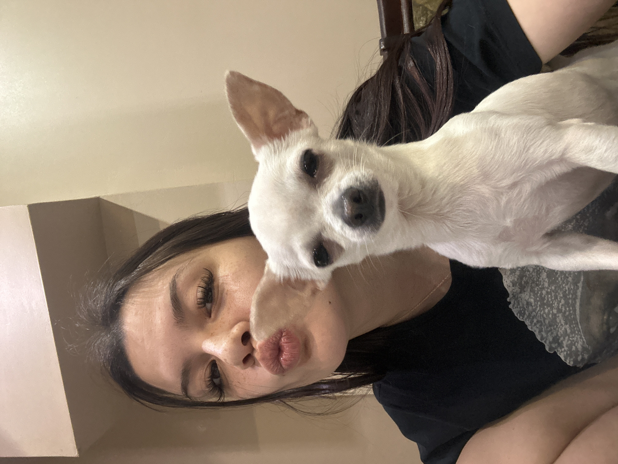 Woman poses with white dog in Sliven, Bulgaria