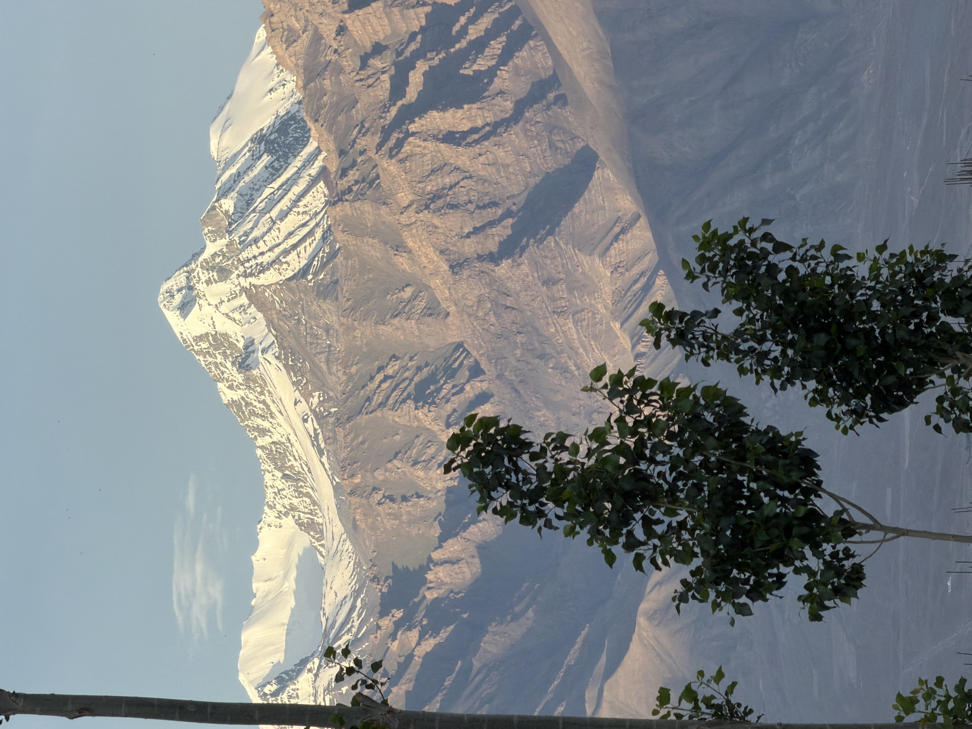 Leh from ground level: mountains, rooftops, and a helicopter