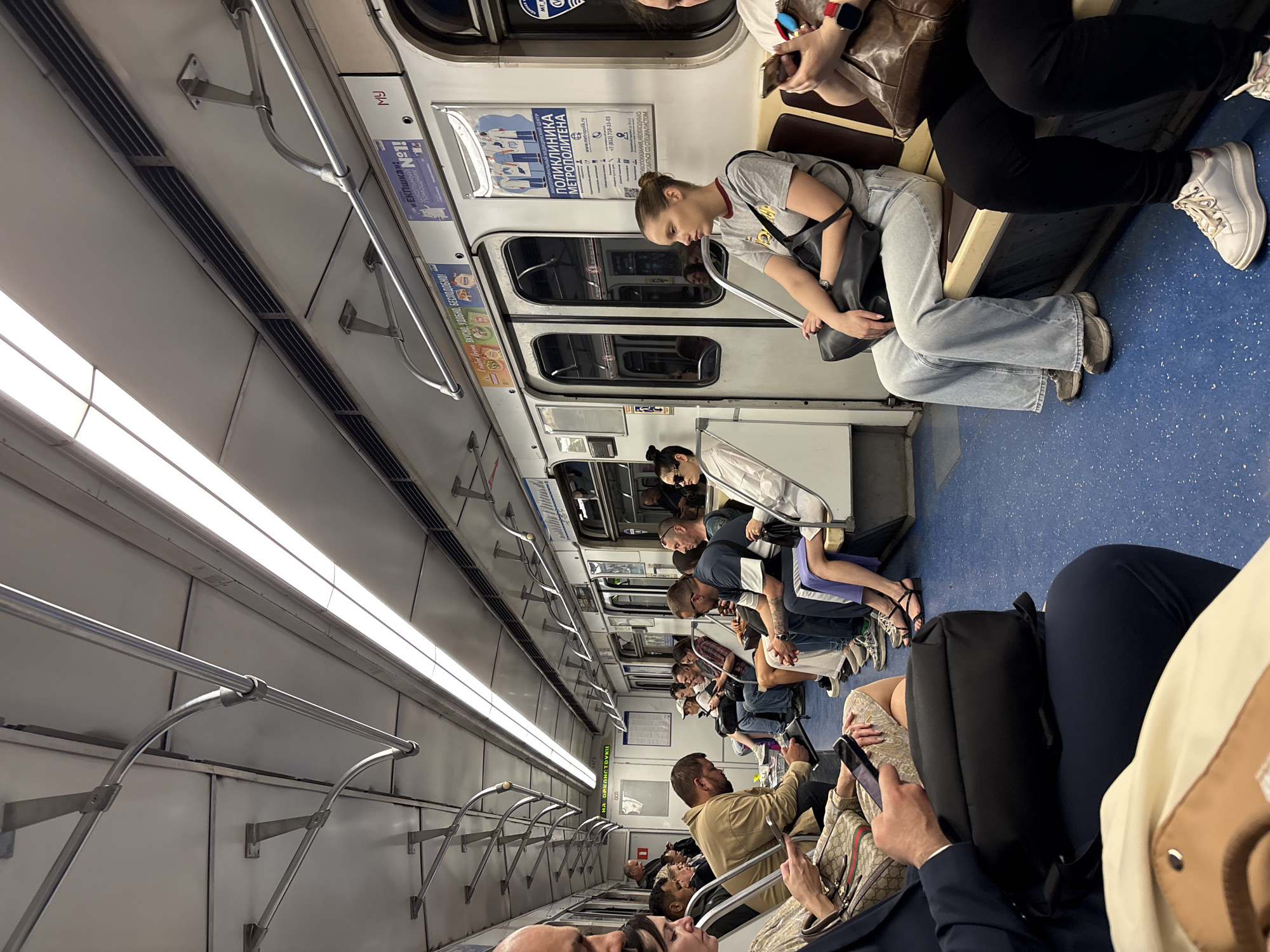 Saint Petersburg subway passengers use phones during transit
