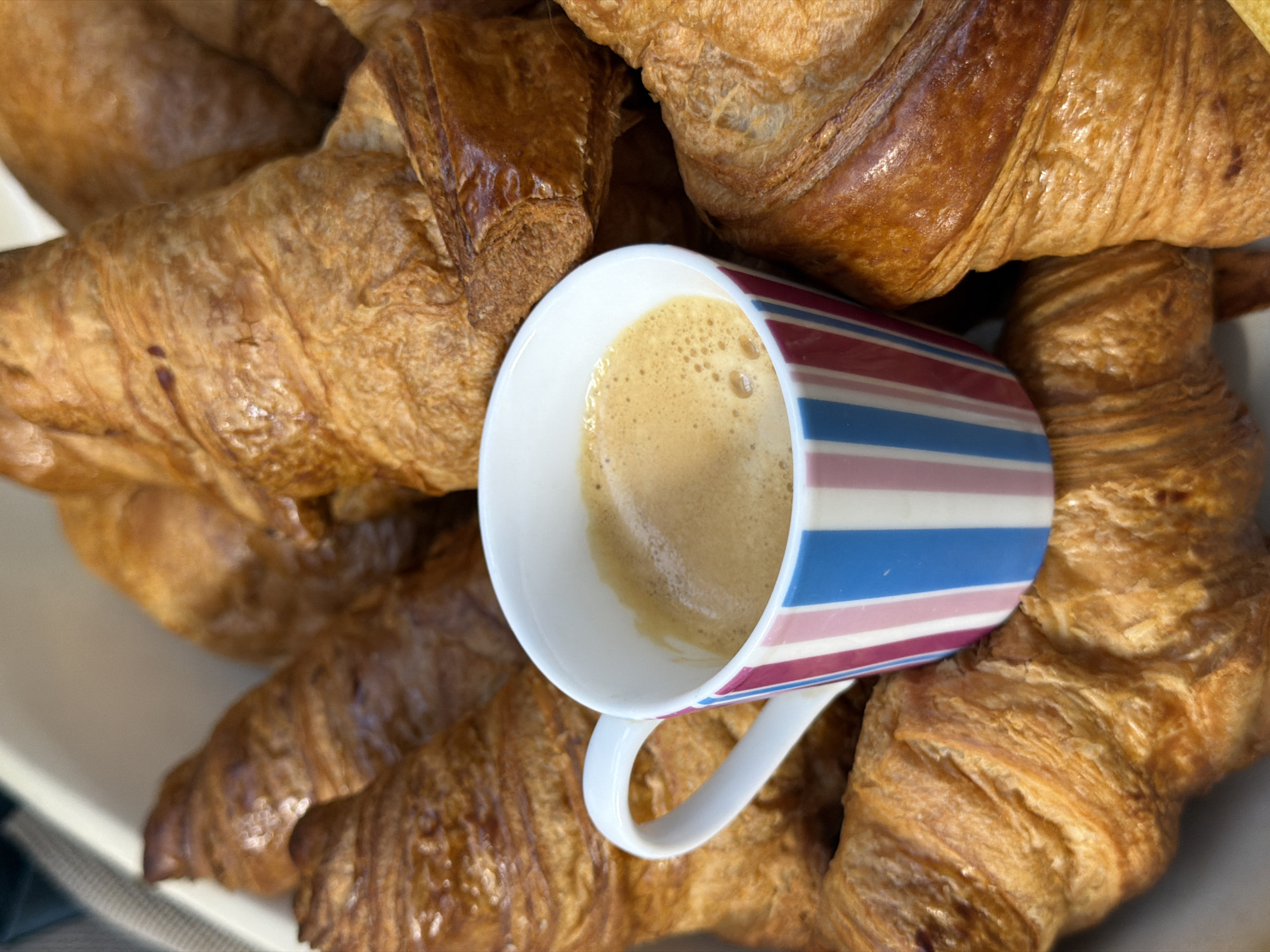 Morning coffee and croissants captured in Luxembourg breakfast scene