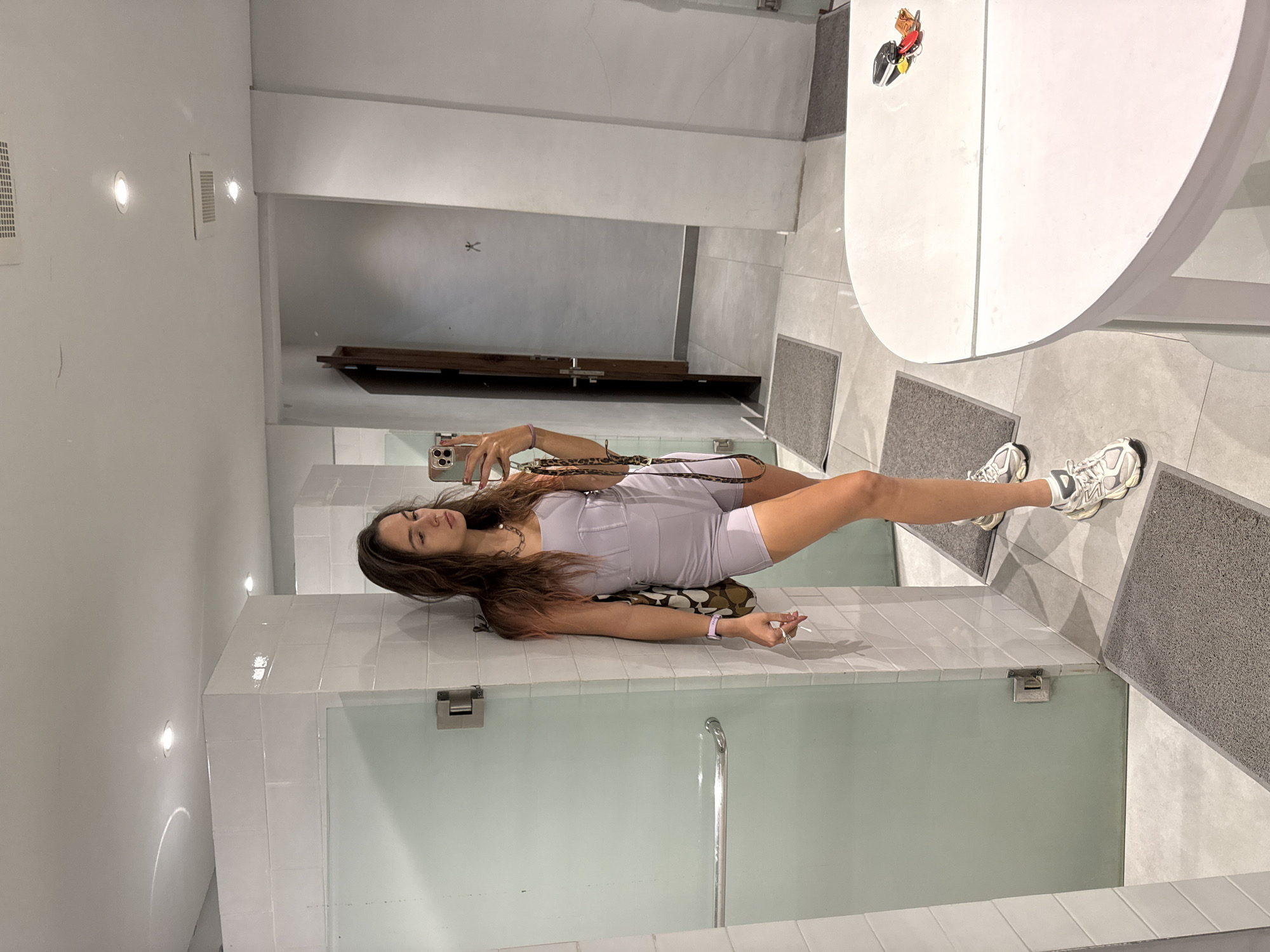 Woman takes selfies at beach club in Canggu, Bali