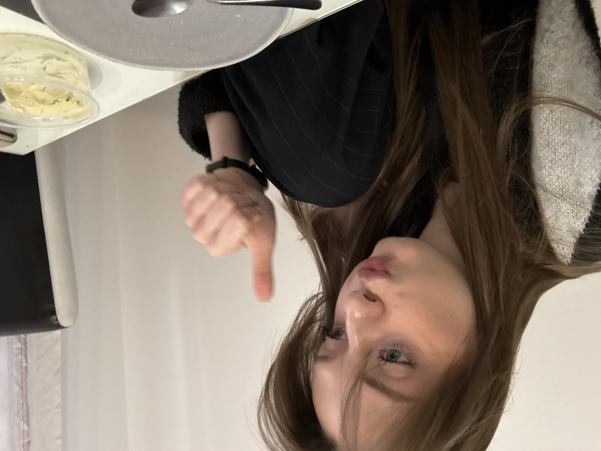 Woman photographs herself with branded items in Kragujevac apartment