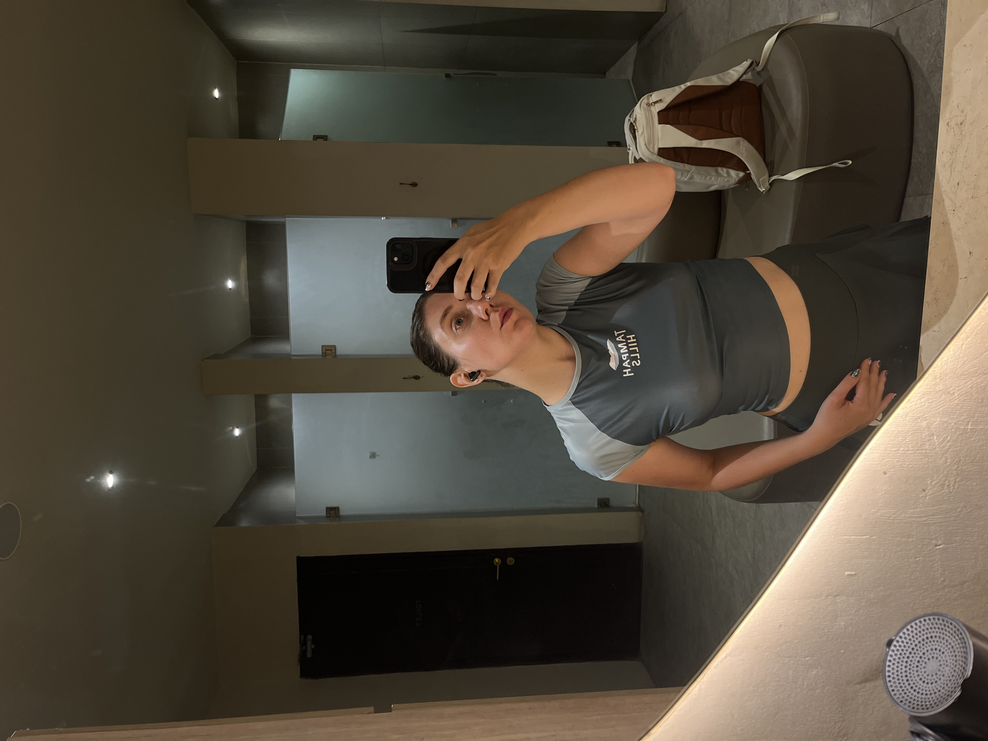 Woman takes selfie in North Kuta locker room