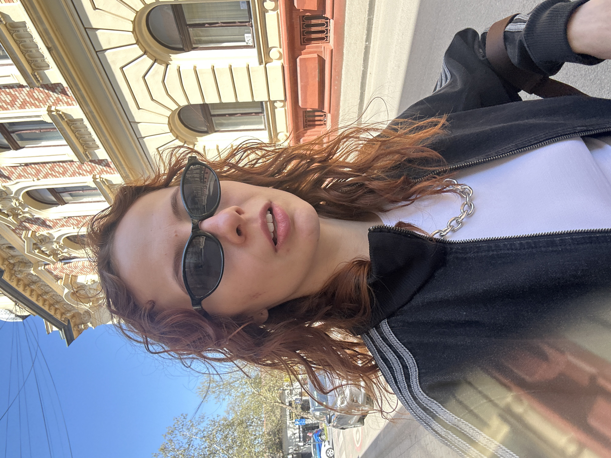 Woman photographed multiple times outdoors in Novi Sad