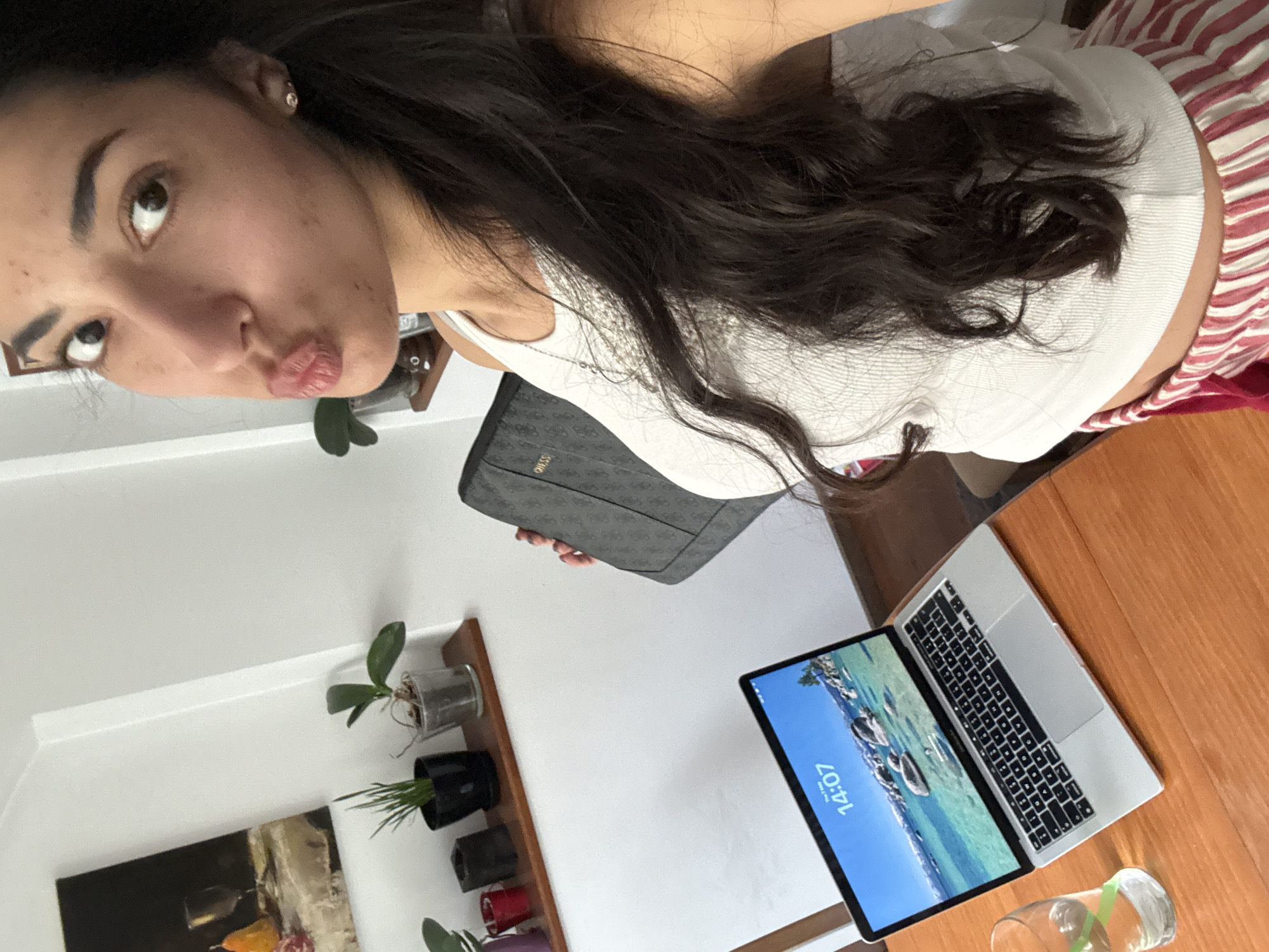 Woman takes playful selfies indoors in Sofia