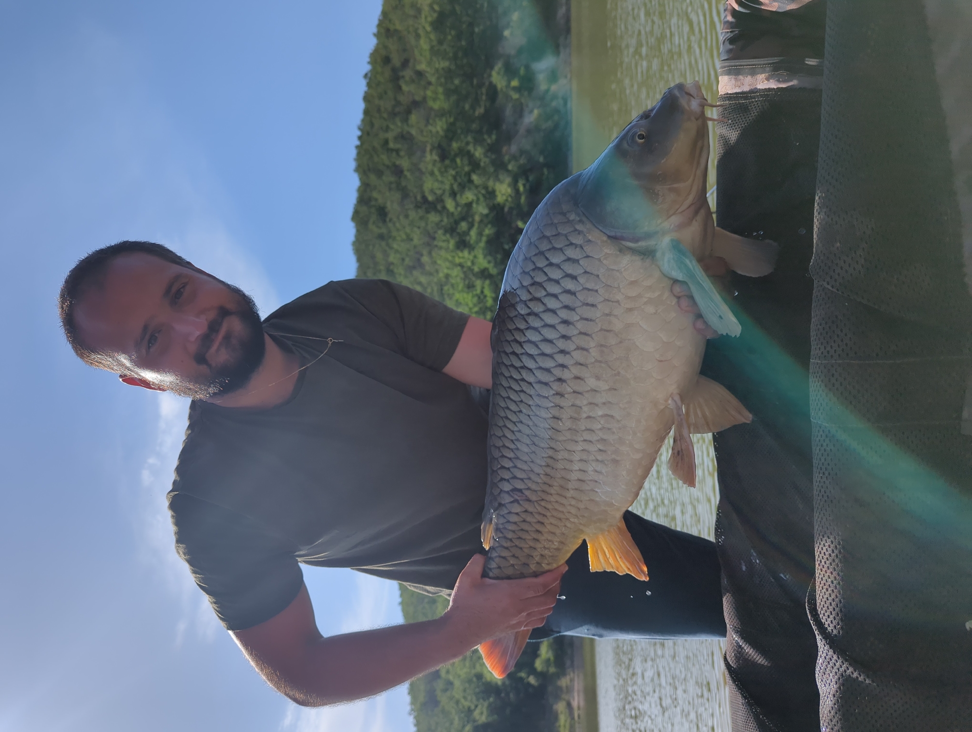 Man catches large carp near Slavovitsa, Bulgaria