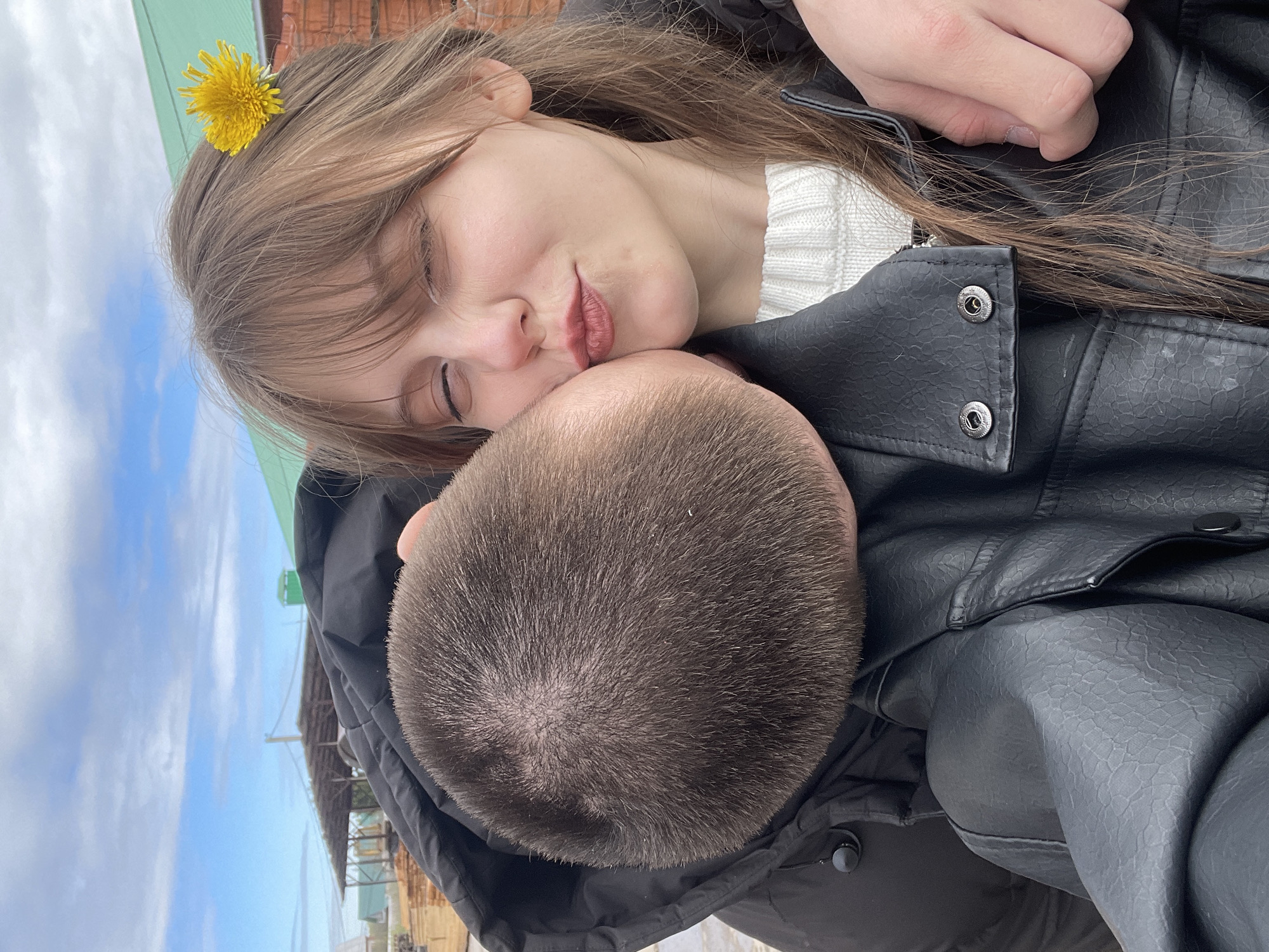 Woman photographed with dandelion flowers in early morning Karmaskaly scene