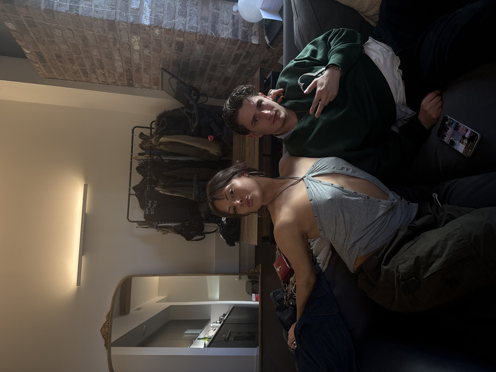 Two people photographed on sofa in Manchester home