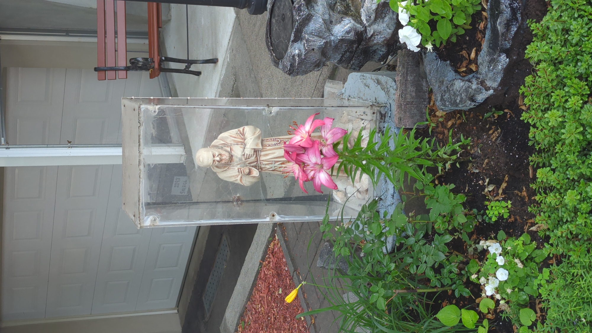 Saint Francis statue in plexiglass shrine, Montreal