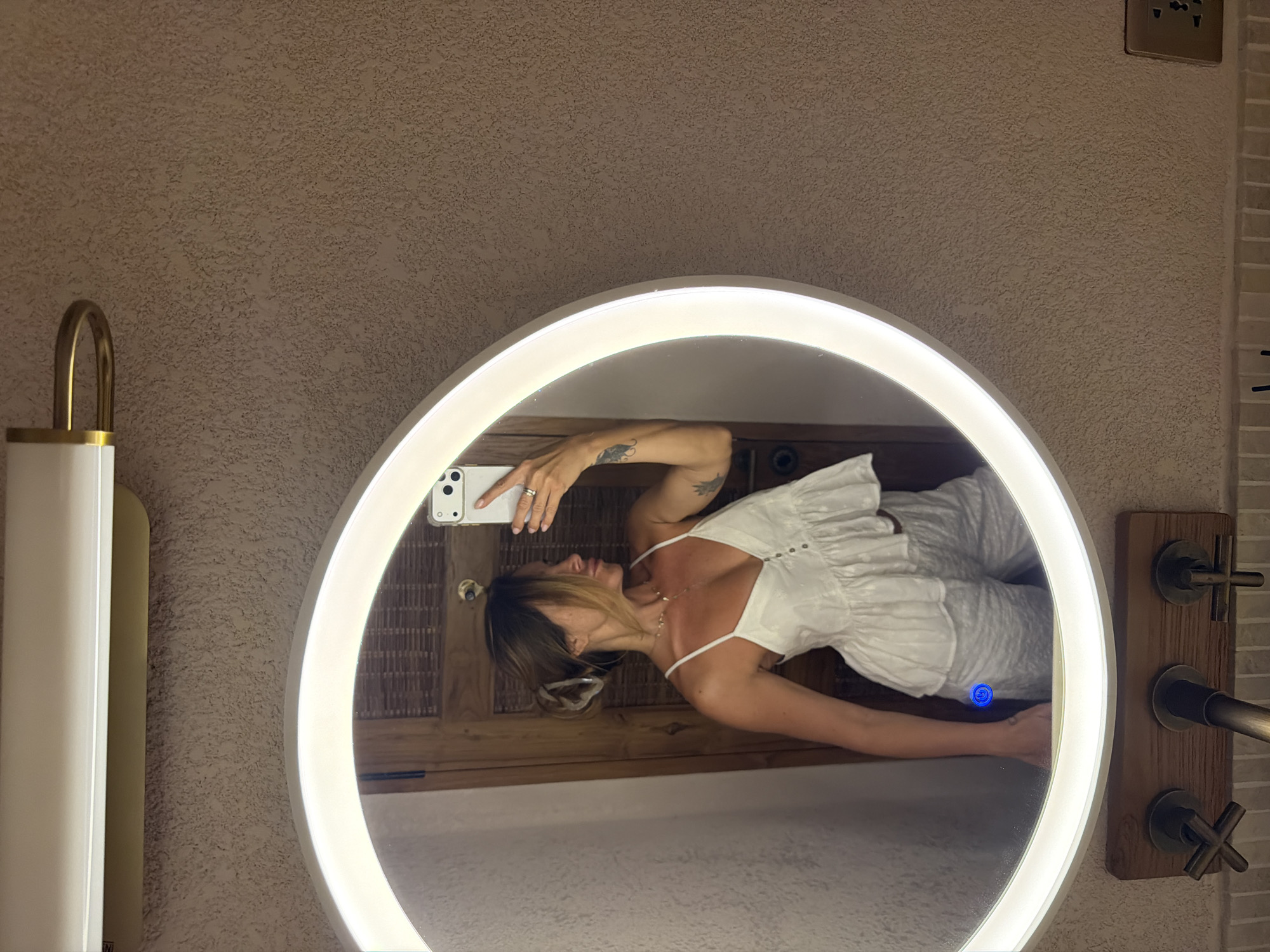 Mirror selfies in a Bali bathroom, white outfit, LED mirror