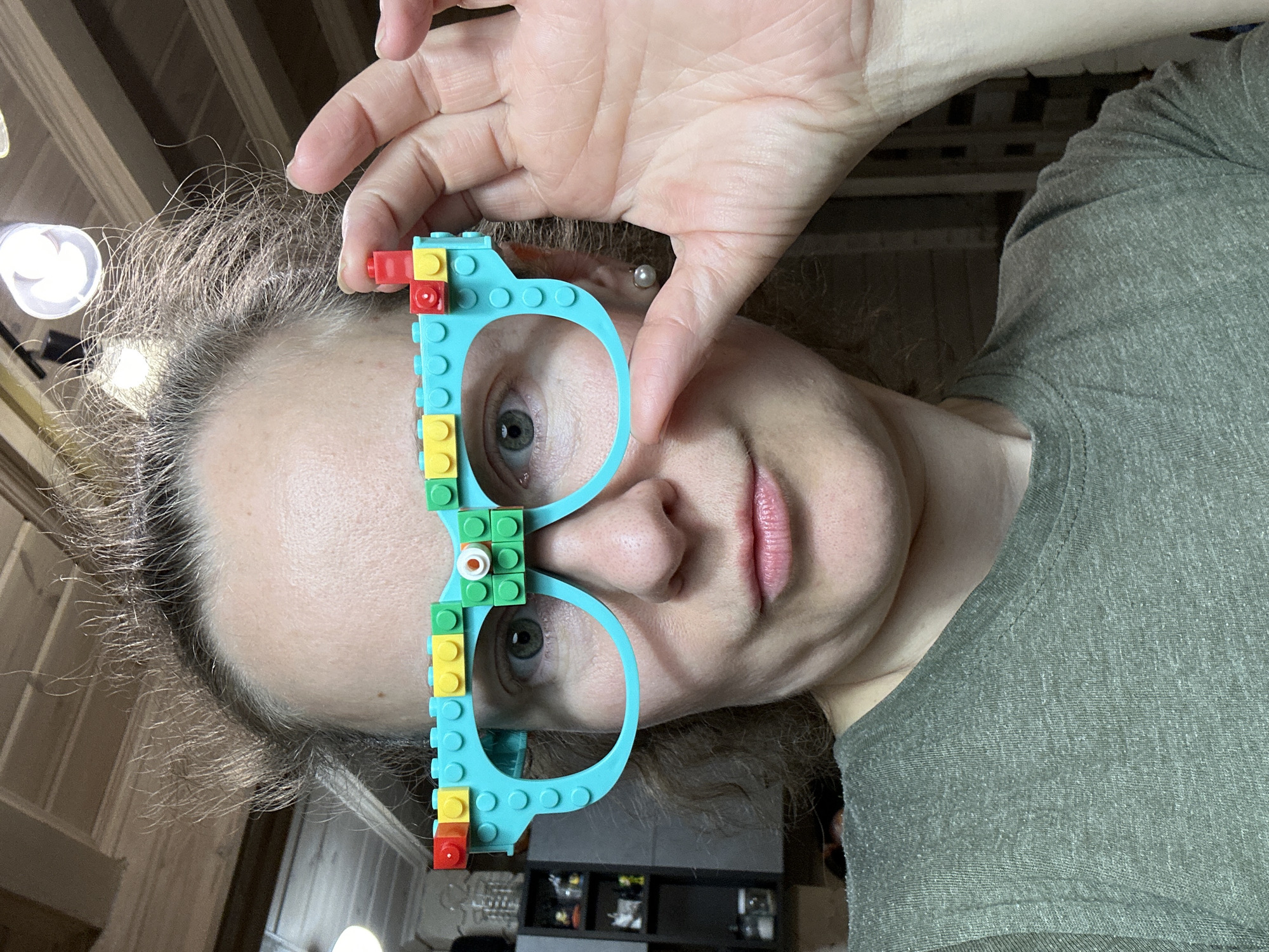 Person displays colorful LEGO brick glasses in Russia
