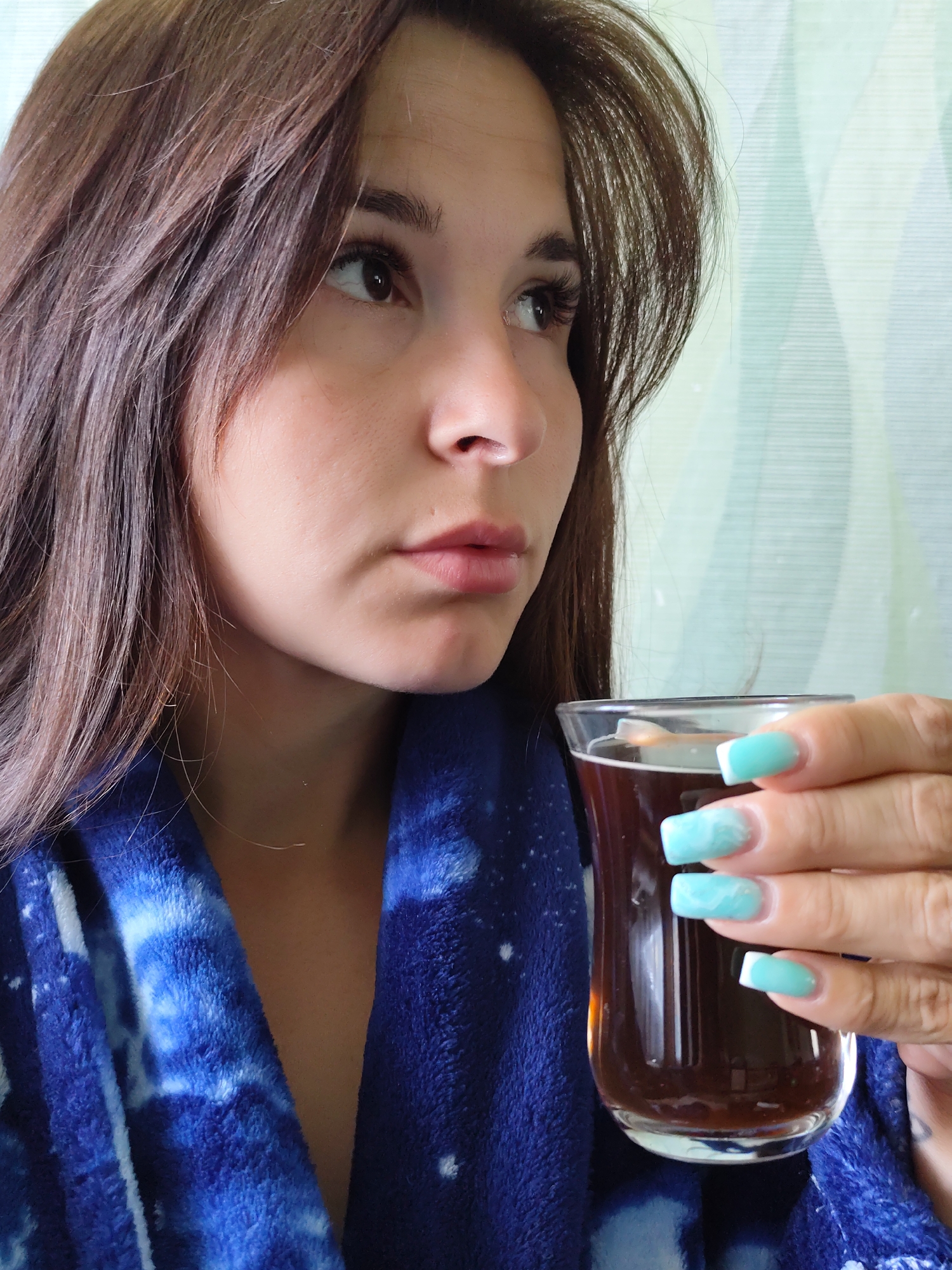 Woman with drink observed in early morning in Foki, Russia