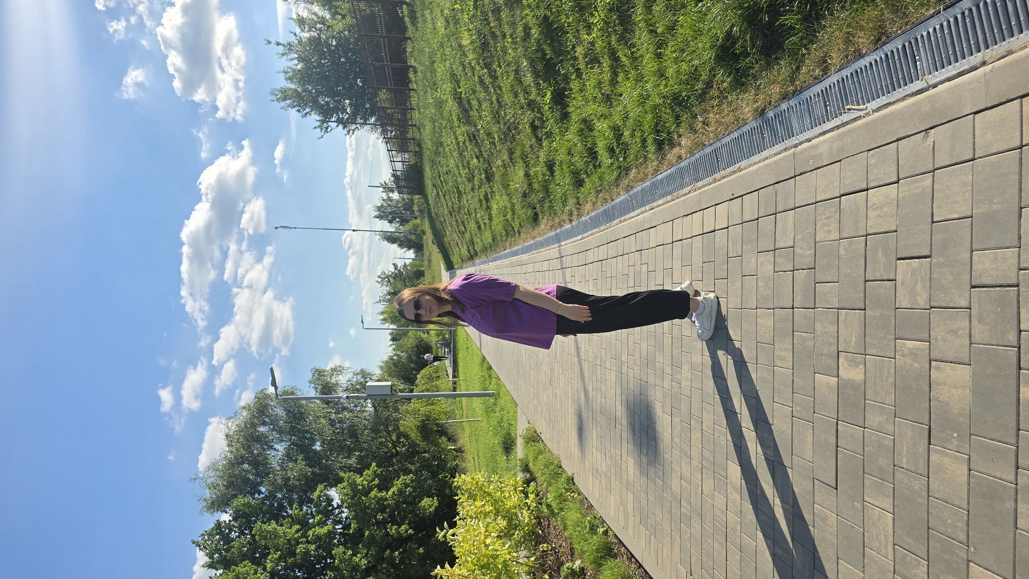 Sunny afternoon stroll along a park path in Razvilka